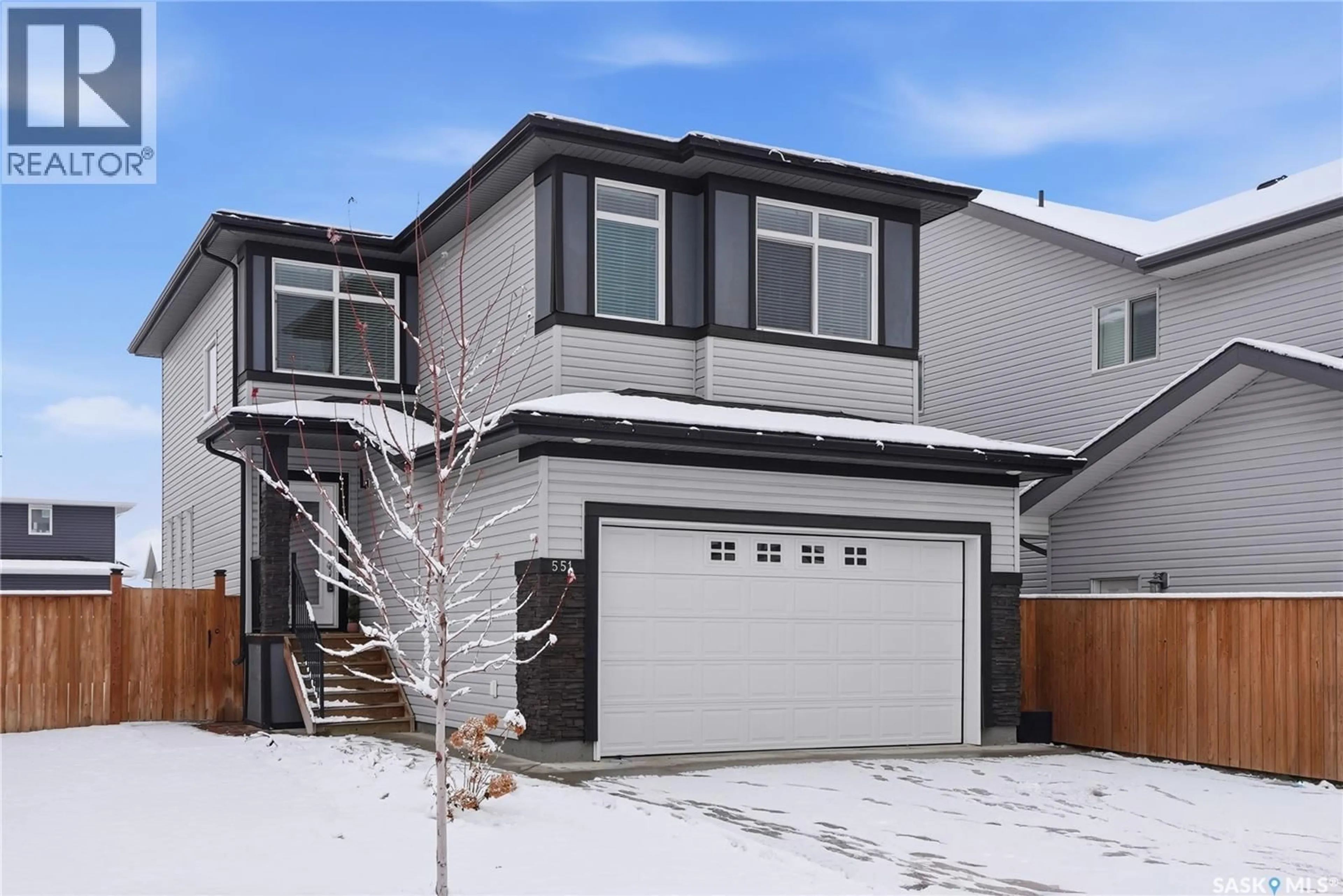 Home with vinyl exterior material, street for 551 KENSINGTON PLACE, Saskatoon Saskatchewan S7L6N5