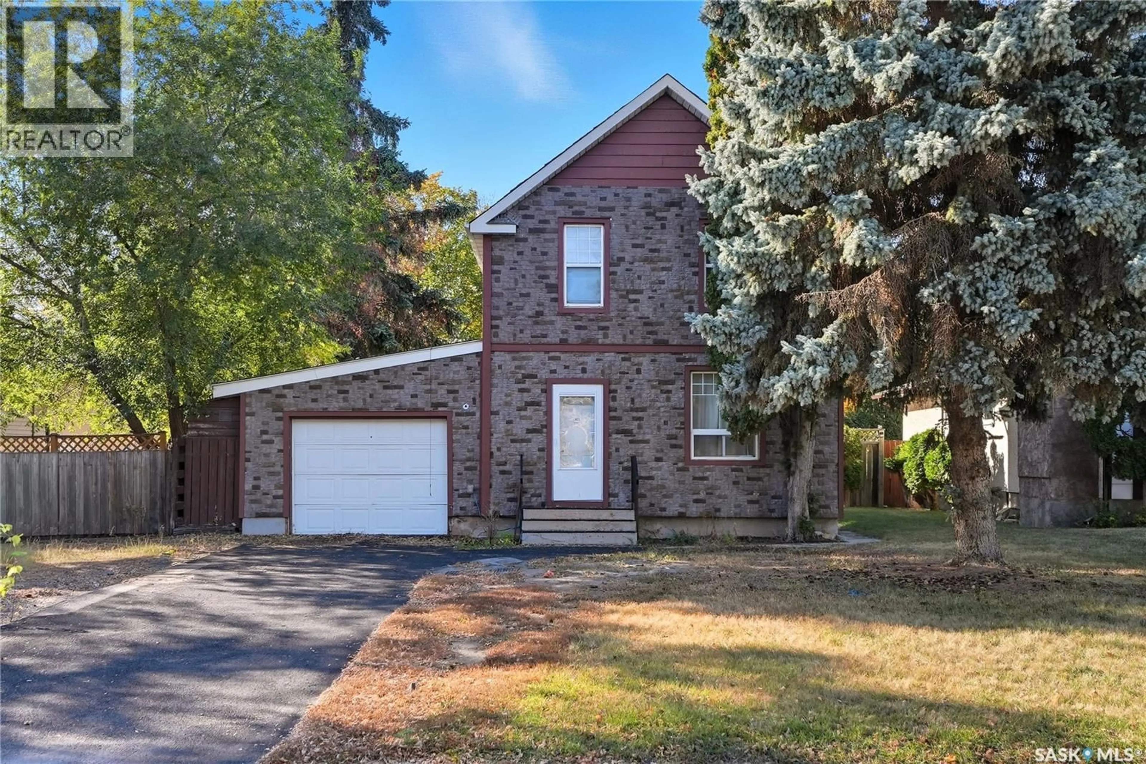 Home with brick exterior material, street for 305 M AVENUE, Saskatoon Saskatchewan S7L2S4