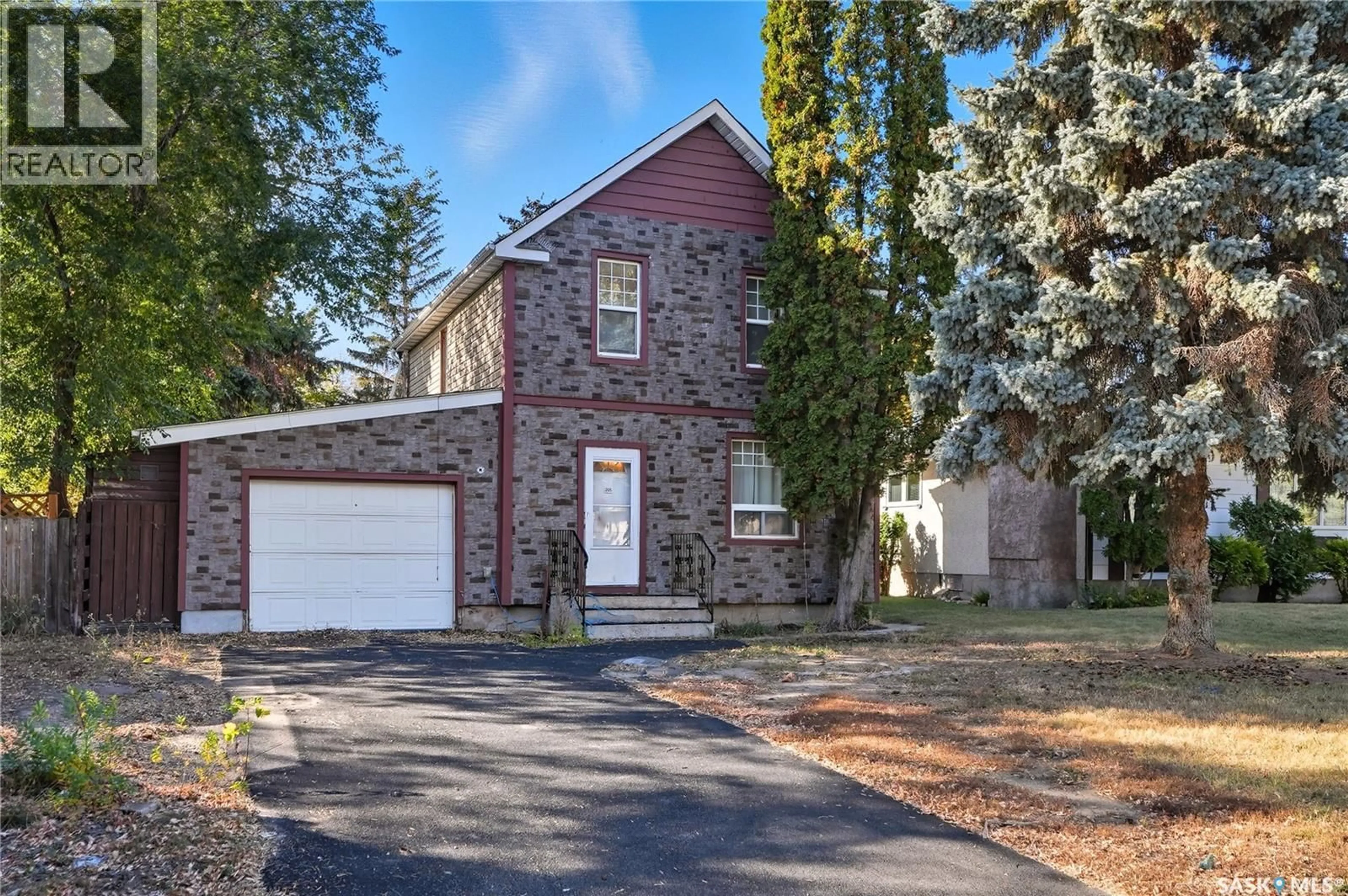 Home with brick exterior material, street for 305 M AVENUE, Saskatoon Saskatchewan S7L2S4