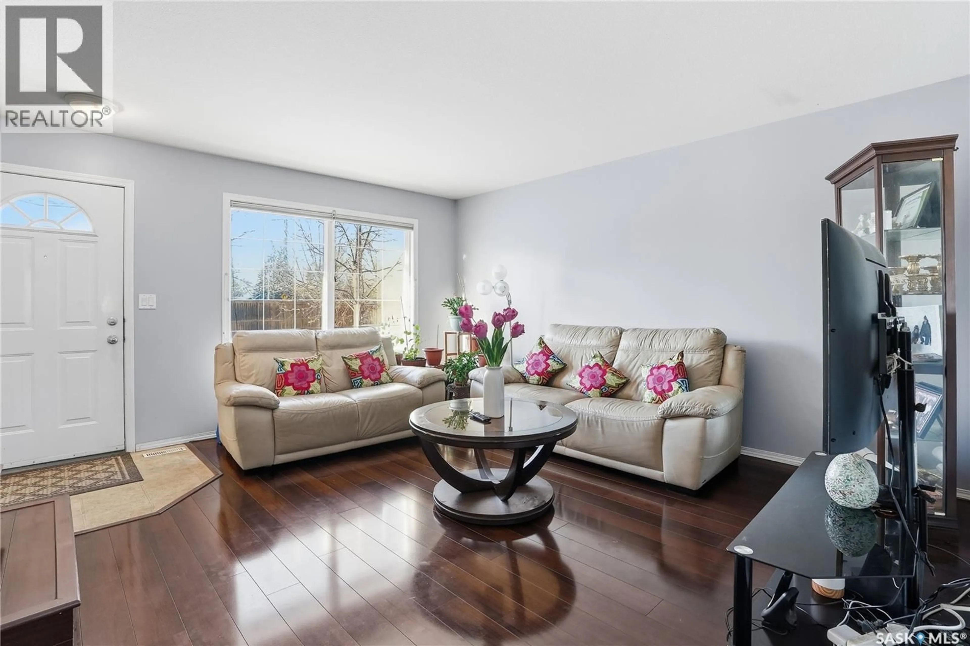 Living room with furniture, wood/laminate floor for 120 103 RUTHERFORD CRESCENT, Saskatoon Saskatchewan S7N4X9