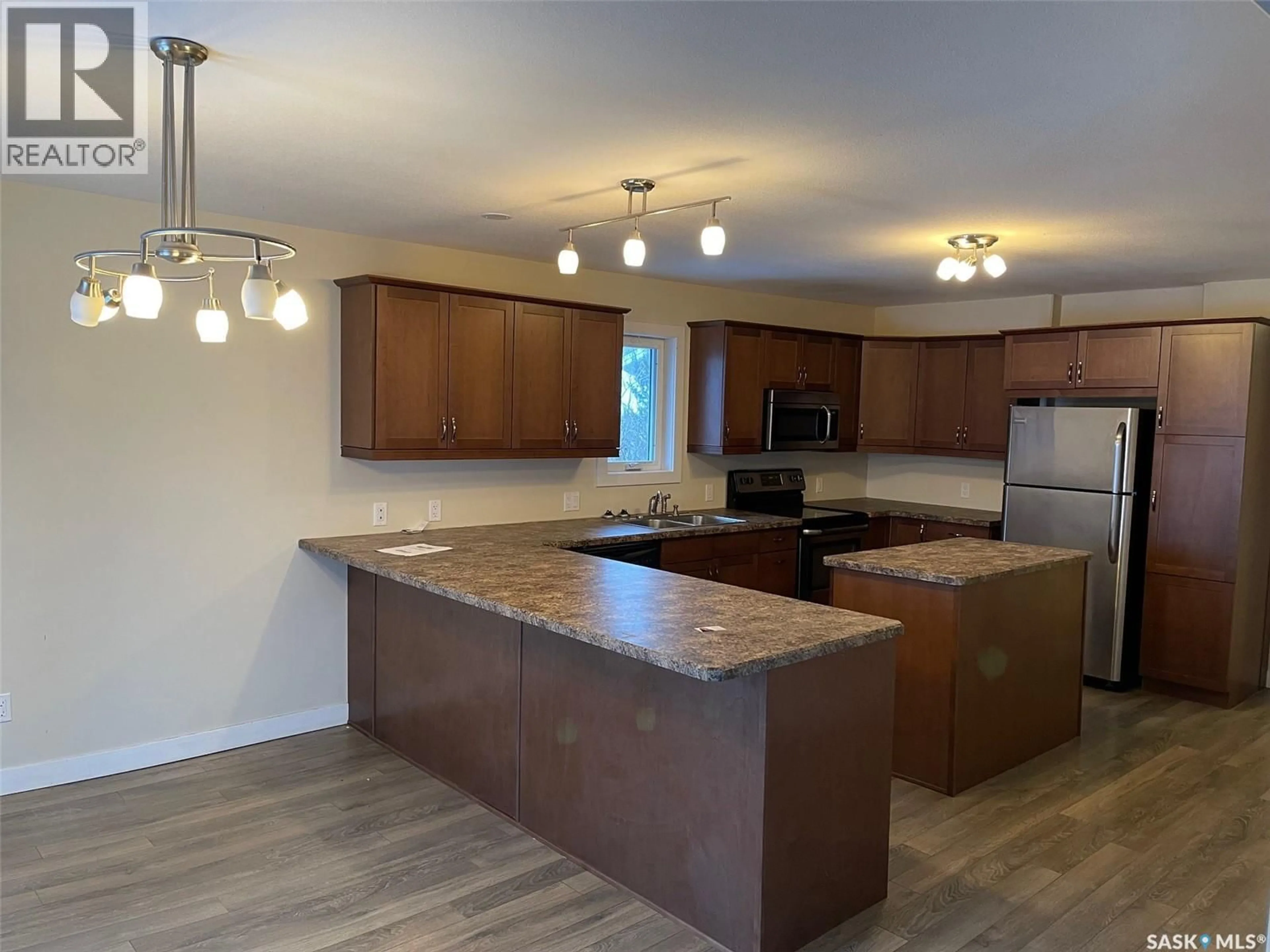 Open concept kitchen, wood/laminate floor for 431 VAUGHAN STREET, Moose Jaw Saskatchewan S6H5N1