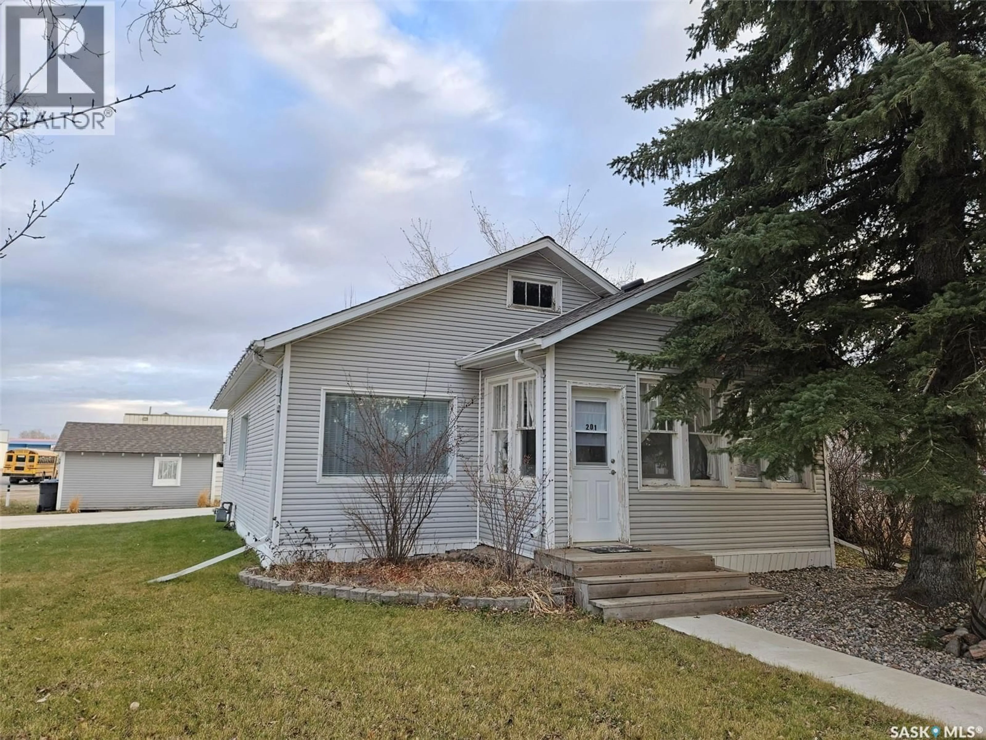 Home with vinyl exterior material, street for 201 SOURIS AVENUE, Carlyle Saskatchewan S0C0R0