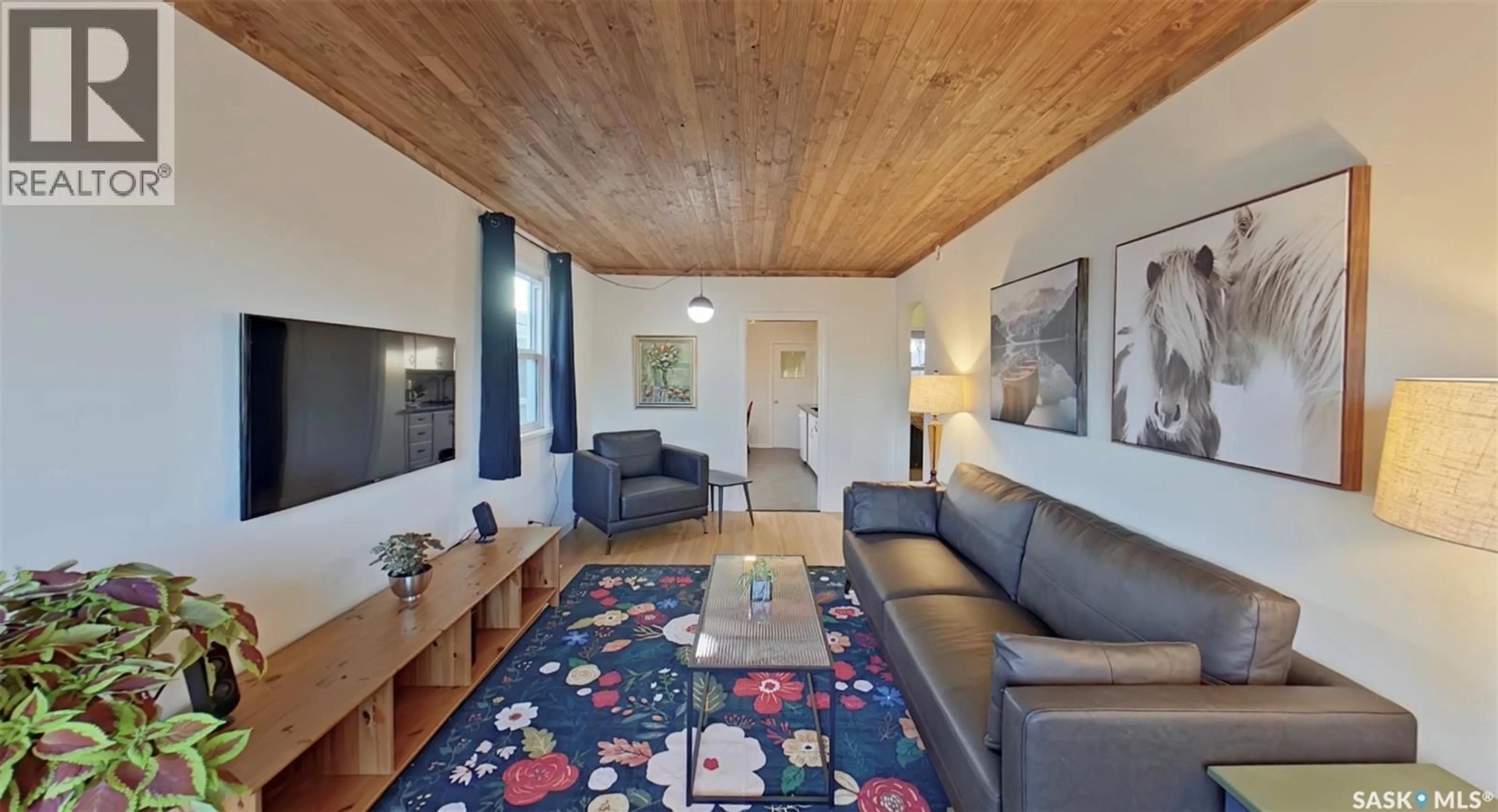 Living room with furniture, wood/laminate floor for 2268 BRODER STREET, Regina Saskatchewan S4N3S6