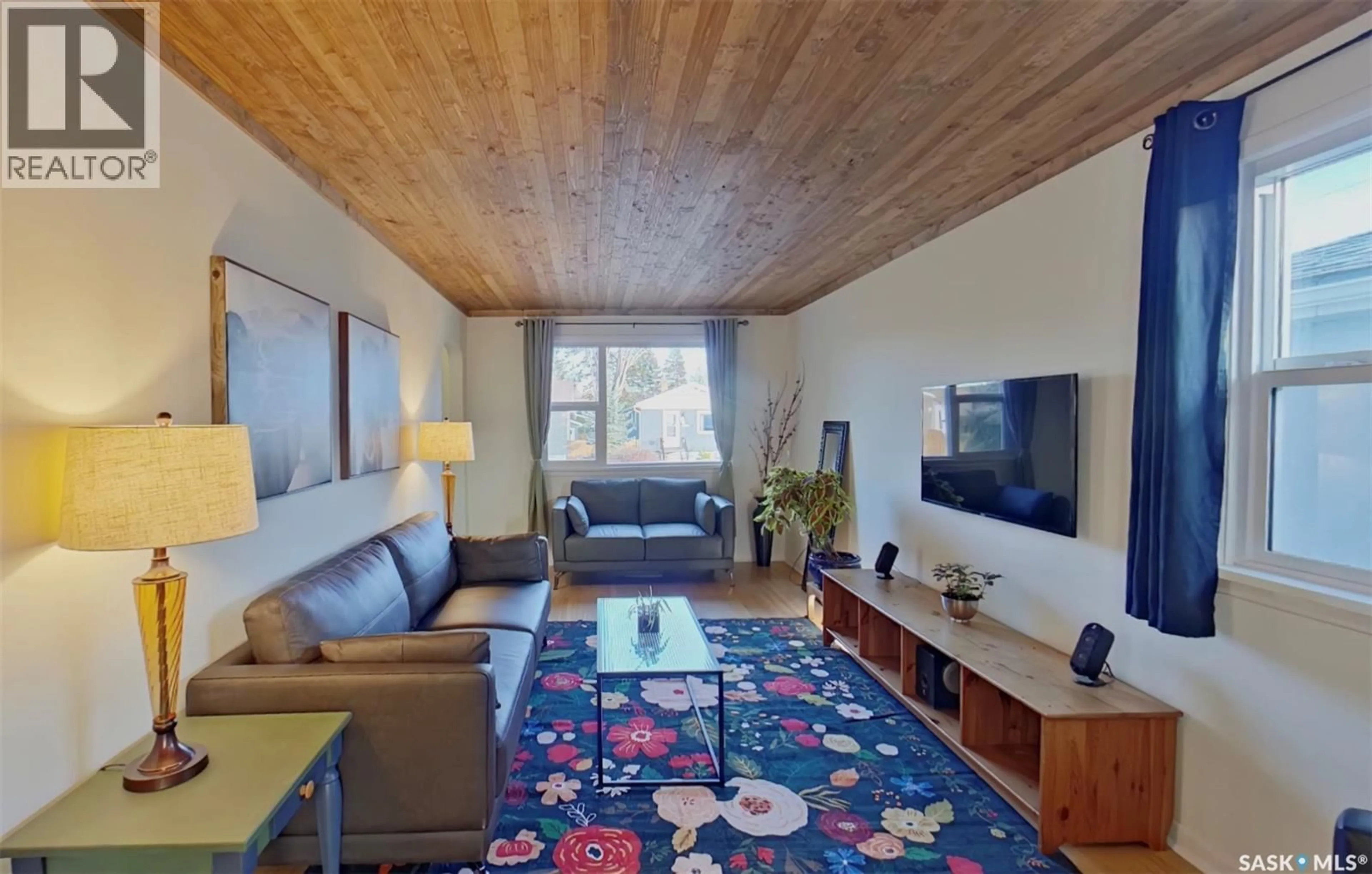 Living room with furniture, wood/laminate floor for 2268 BRODER STREET, Regina Saskatchewan S4N3S6