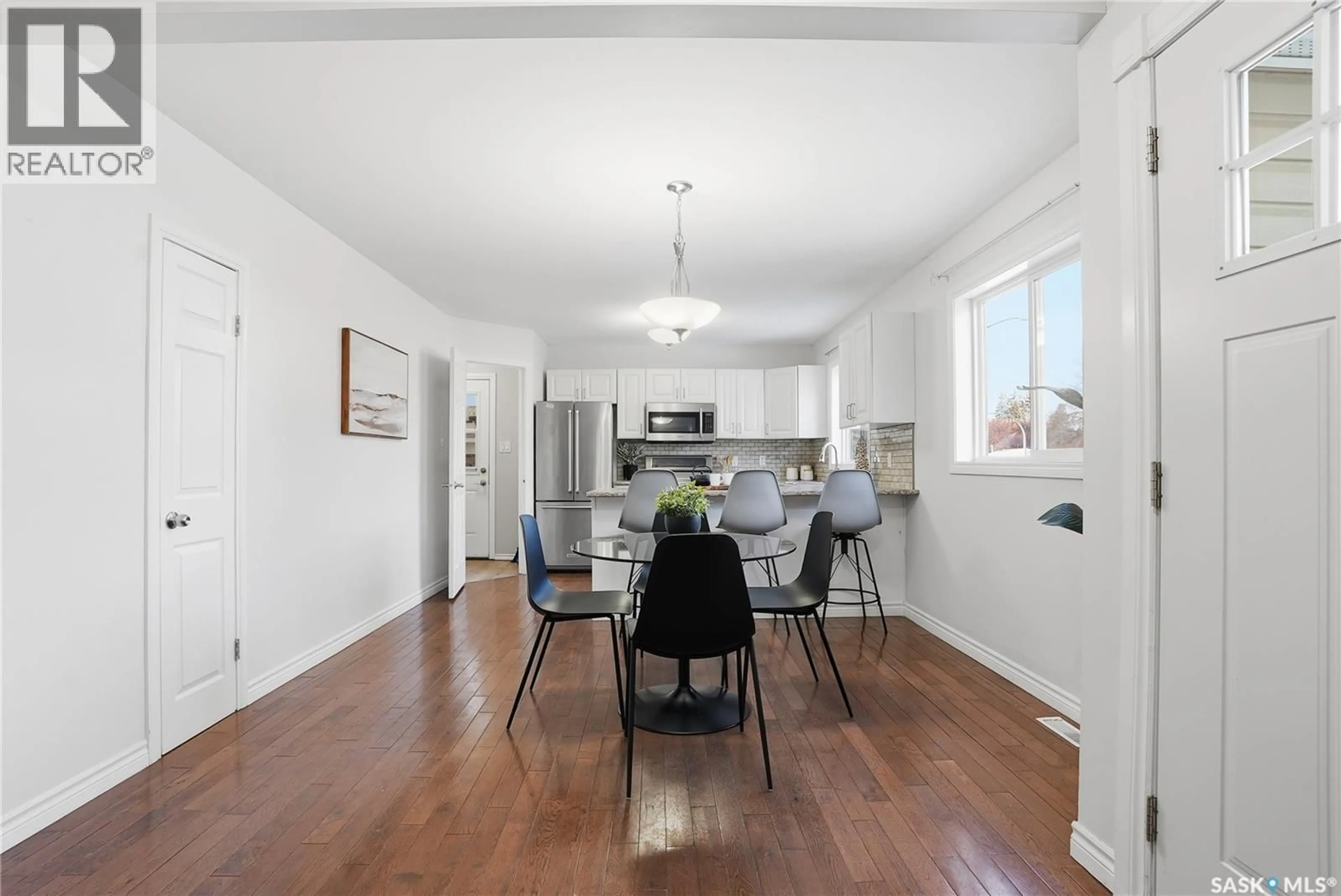 Open concept kitchen, wood/laminate floor for 1804 WILSON CRESCENT, Saskatoon Saskatchewan S7J2N9