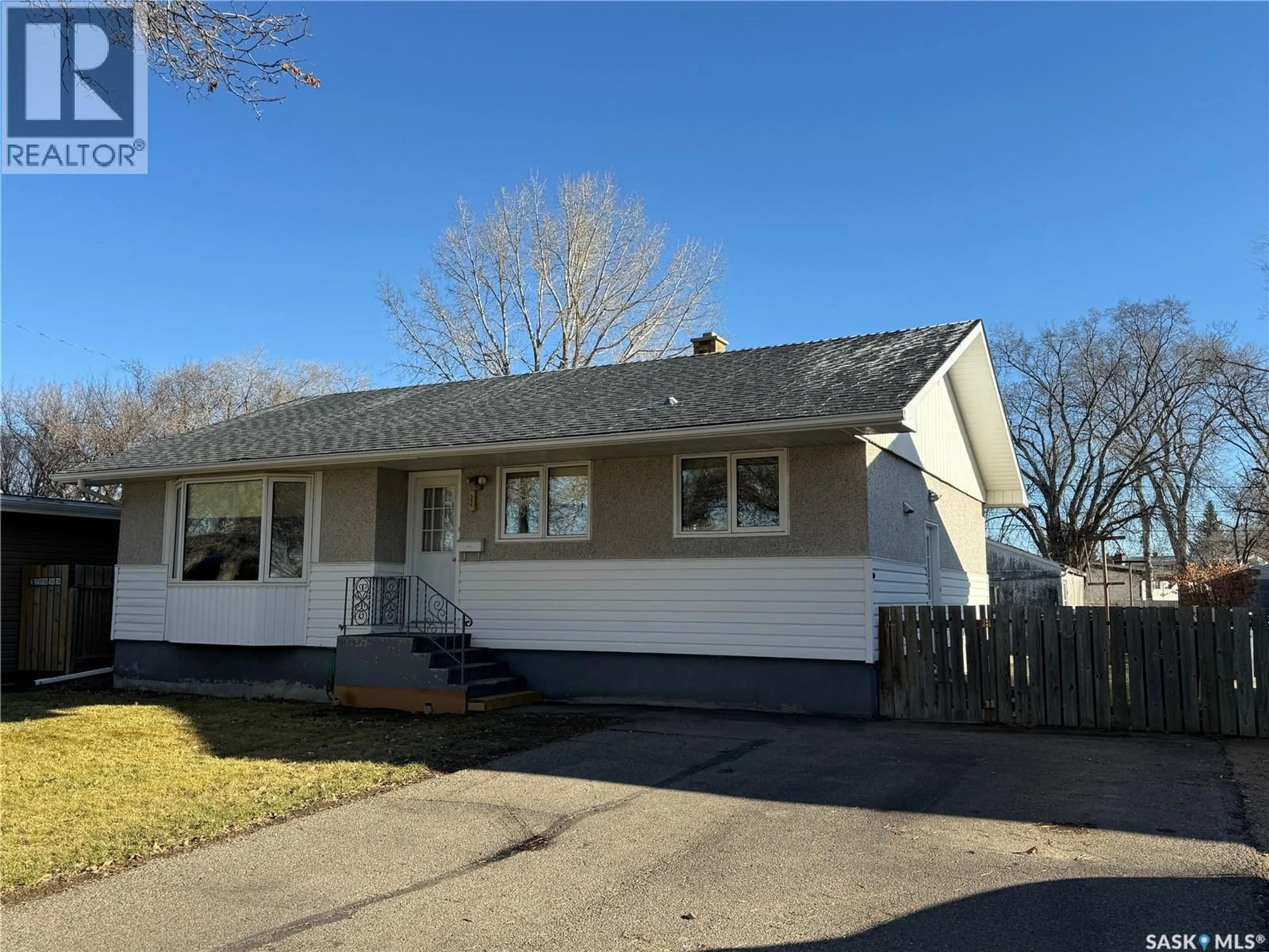 Home with vinyl exterior material, street for 127 ASH DRIVE, Weyburn Saskatchewan S4H0S3