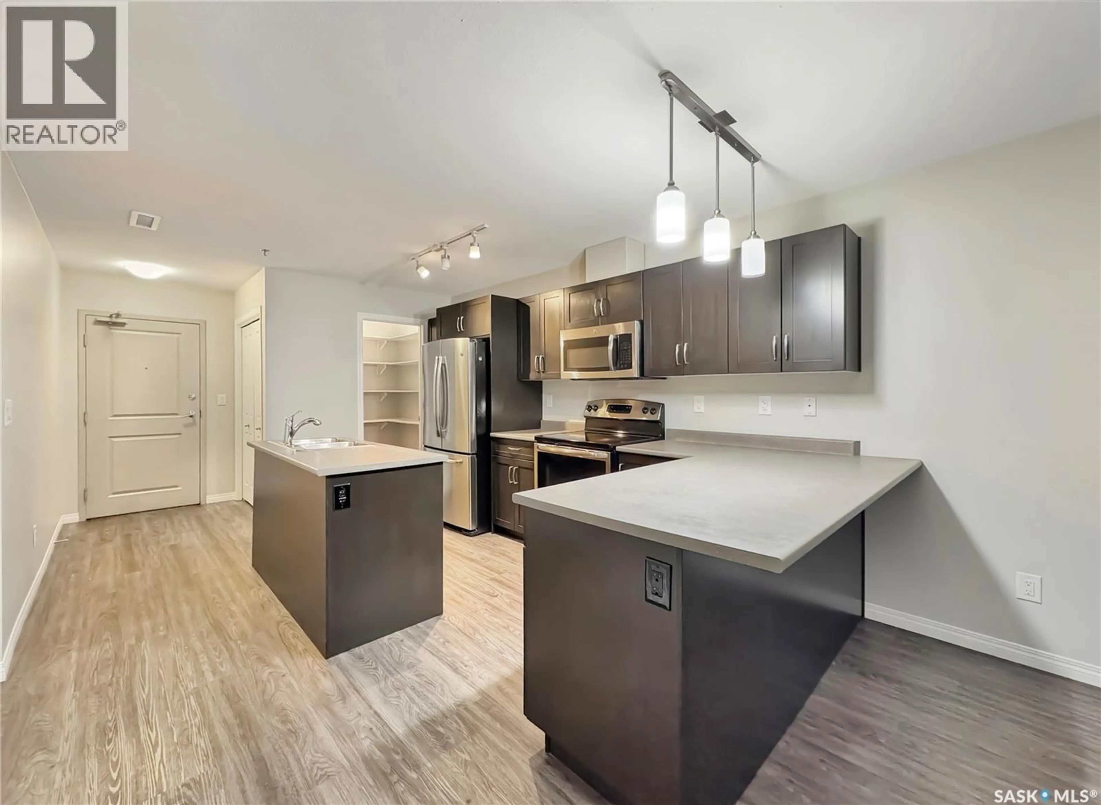 Open concept kitchen, unknown for 205 - 2452 KILLDEER DRIVE, North Battleford Saskatchewan S9A3T5