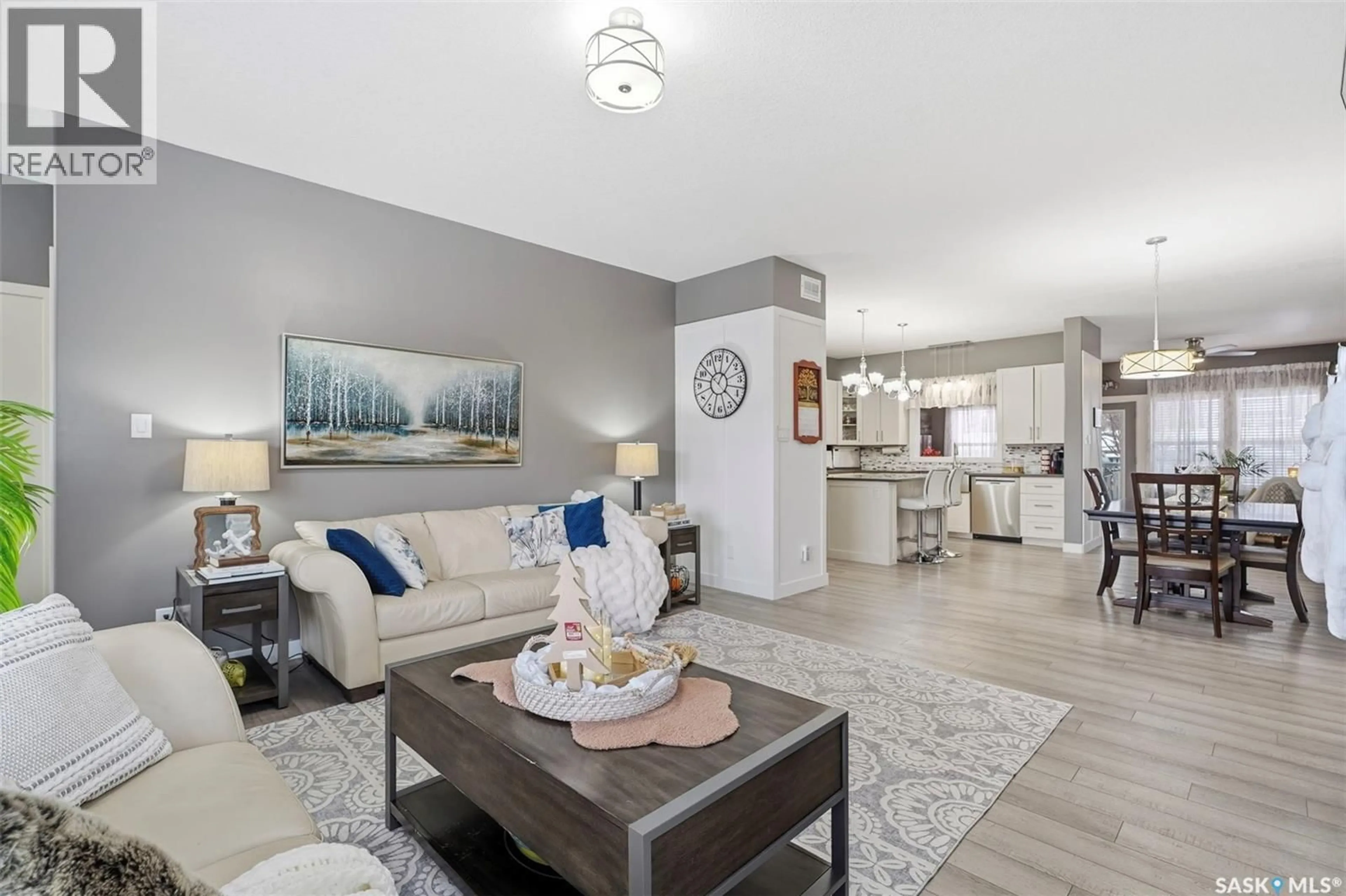 Living room with furniture, unknown for 113 OLAUSON CRESCENT, Vanscoy Saskatchewan S0L3J0