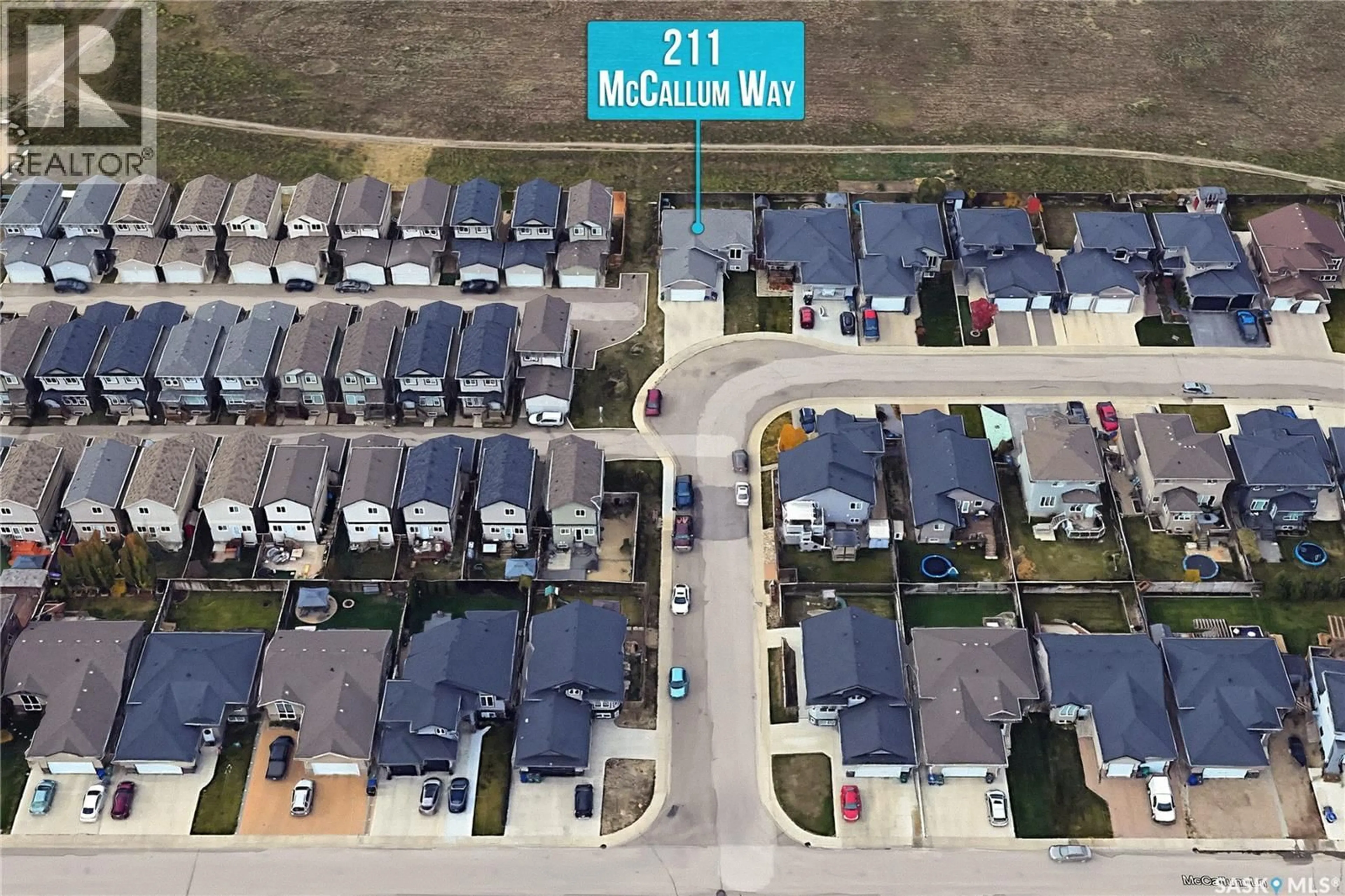 A pic from outside/outdoor area/front of a property/back of a property/a pic from drone, street for 211 MCCALLUM WAY, Saskatoon Saskatchewan S7R0J3