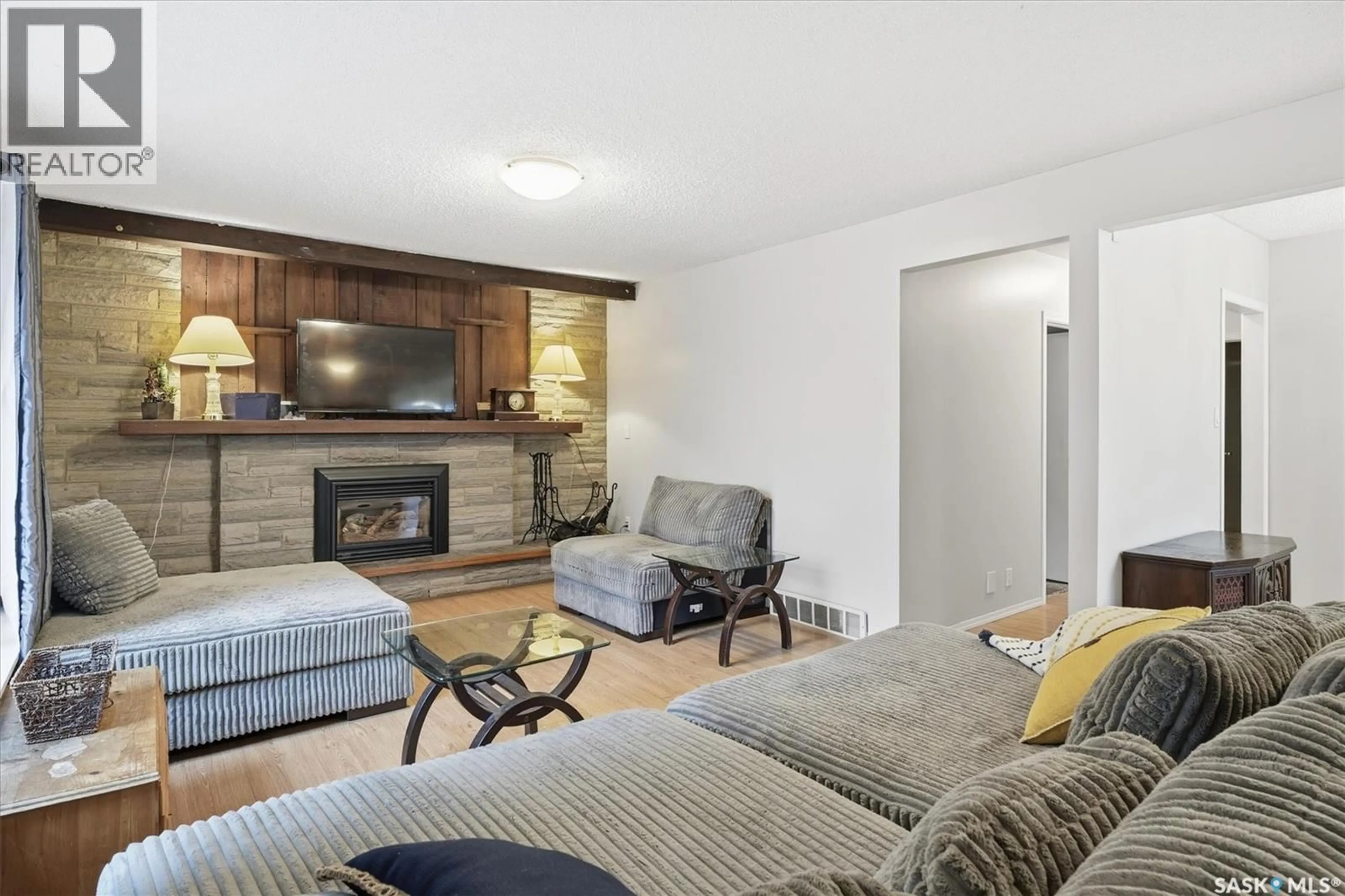 Living room with furniture, wood/laminate floor for 2230 ST PATRICK AVENUE, Saskatoon Saskatchewan S7M0L3