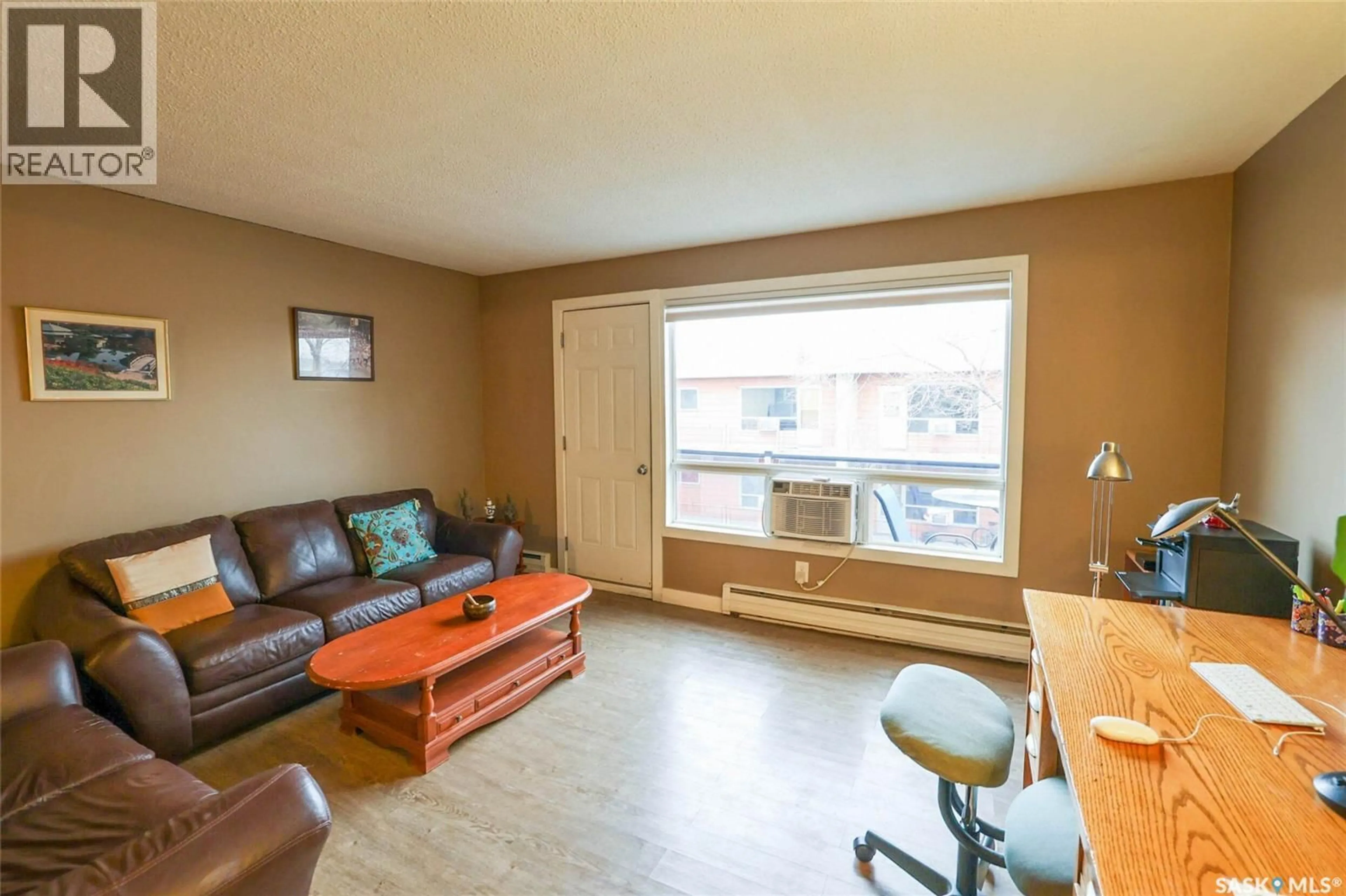 Living room with furniture, wood/laminate floor for 47 42 SPENCE STREET, Regina Saskatchewan S4S4H4