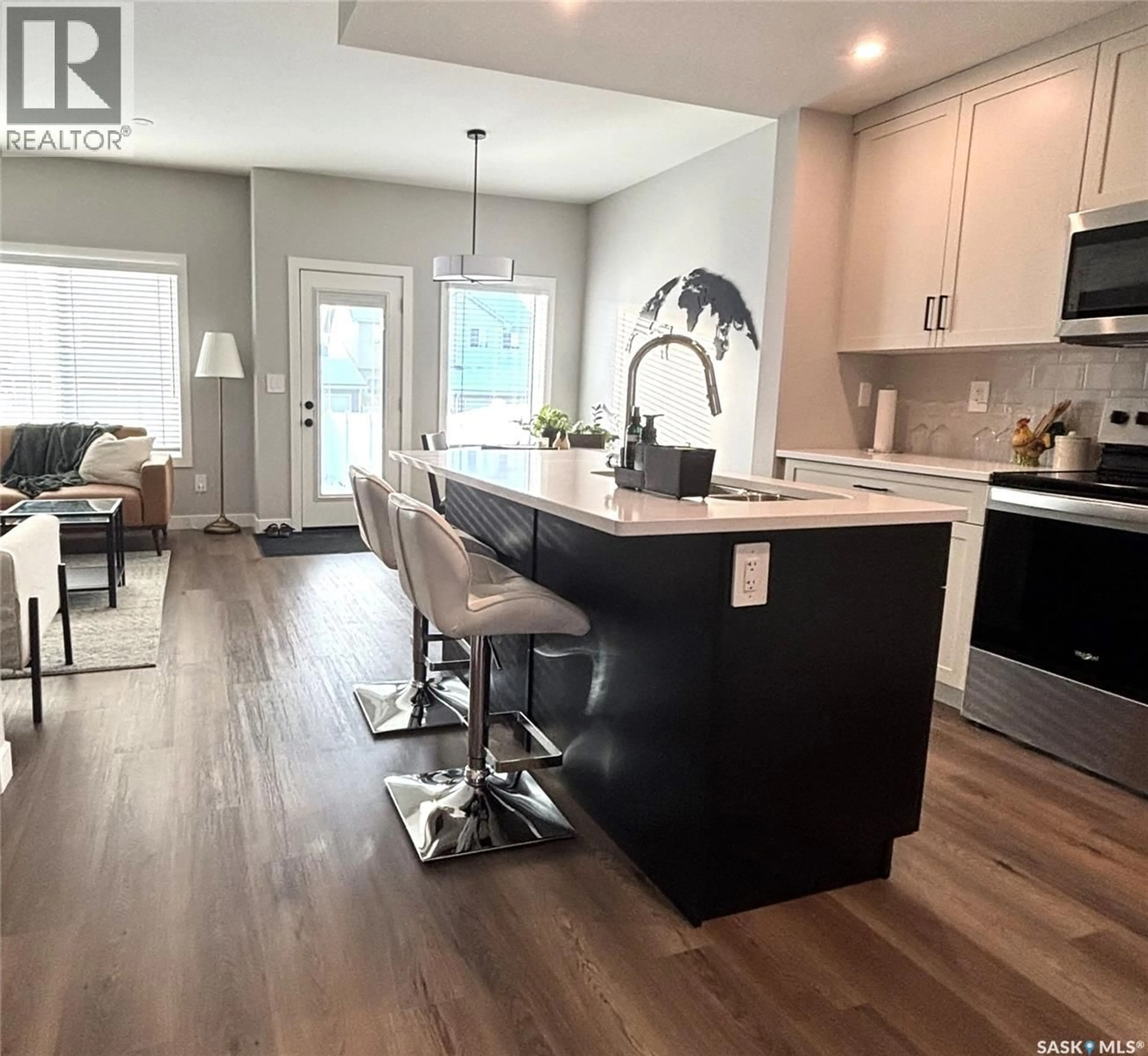 Open concept kitchen, wood/laminate floor for 540 MYLES HEIDT MANOR, Saskatoon Saskatchewan S7W0Z4