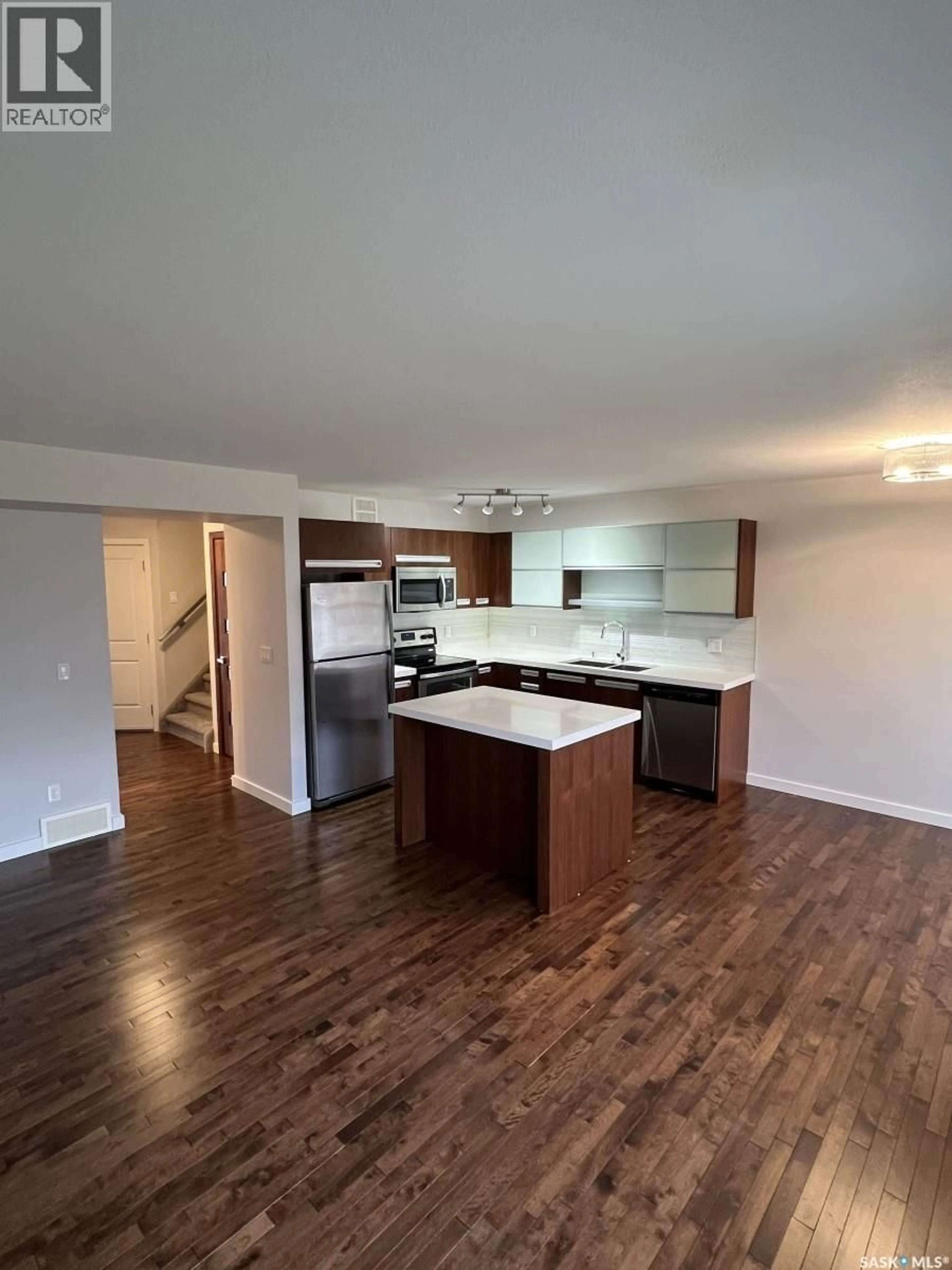 Open concept kitchen, wood/laminate floor for 505 - 1303 PATON CRESCENT, Saskatoon Saskatchewan S7W0P7