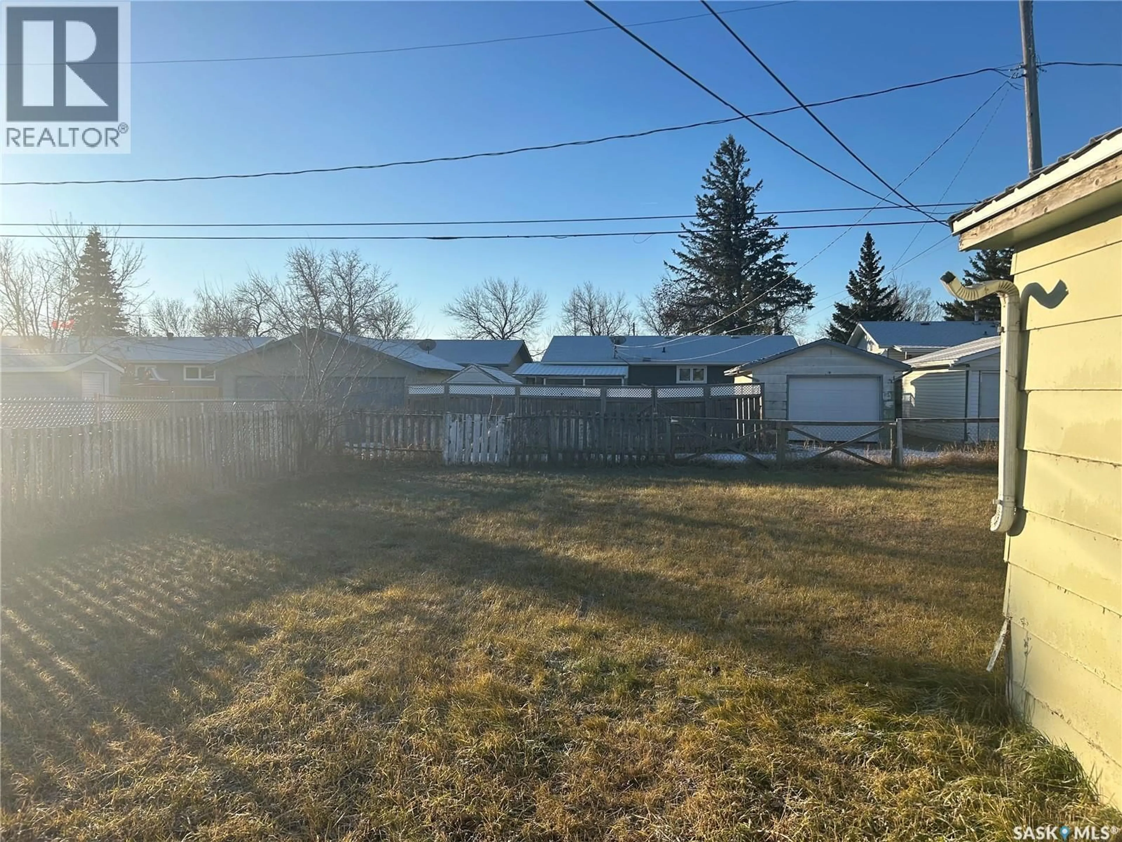 A pic from outside/outdoor area/front of a property/back of a property/a pic from drone, street for 618 98TH AVENUE, Tisdale Saskatchewan S0E1T0