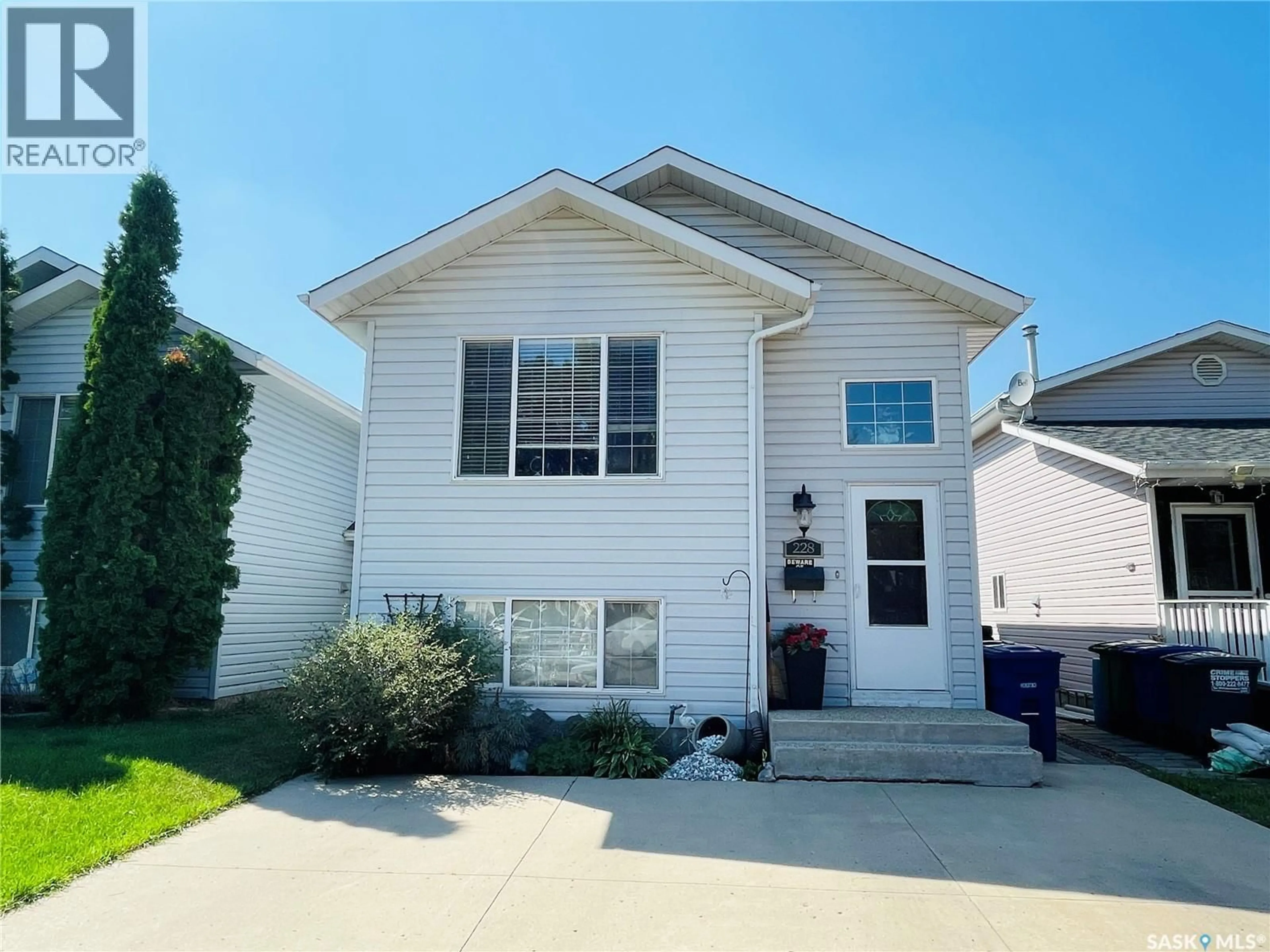 Home with vinyl exterior material, street for 228 LOCHRIE CRESCENT, Saskatoon Saskatchewan S7M5E4