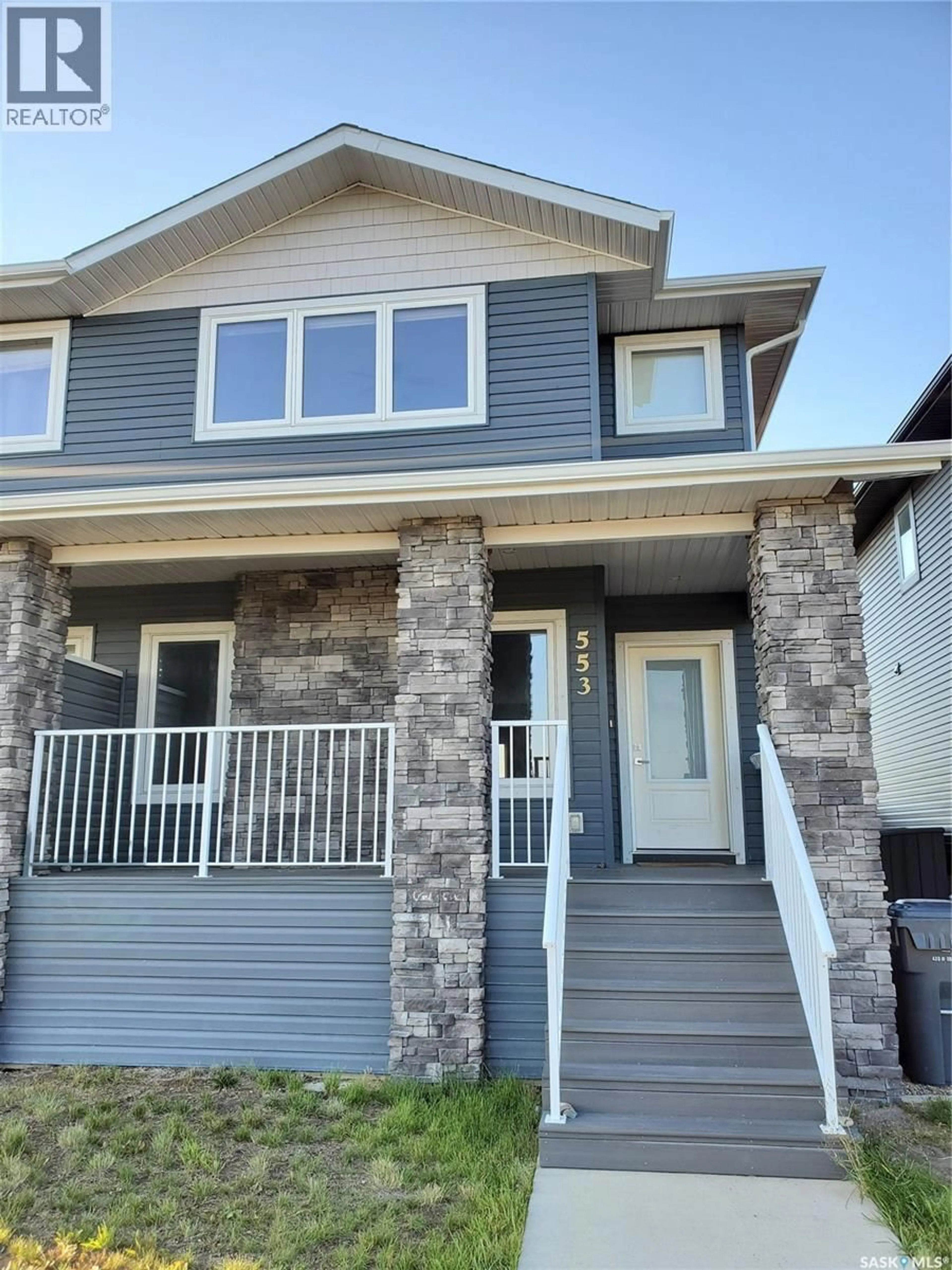 Home with vinyl exterior material, street for 553 DOUGLAS DRIVE, Swift Current Saskatchewan S9H5R6