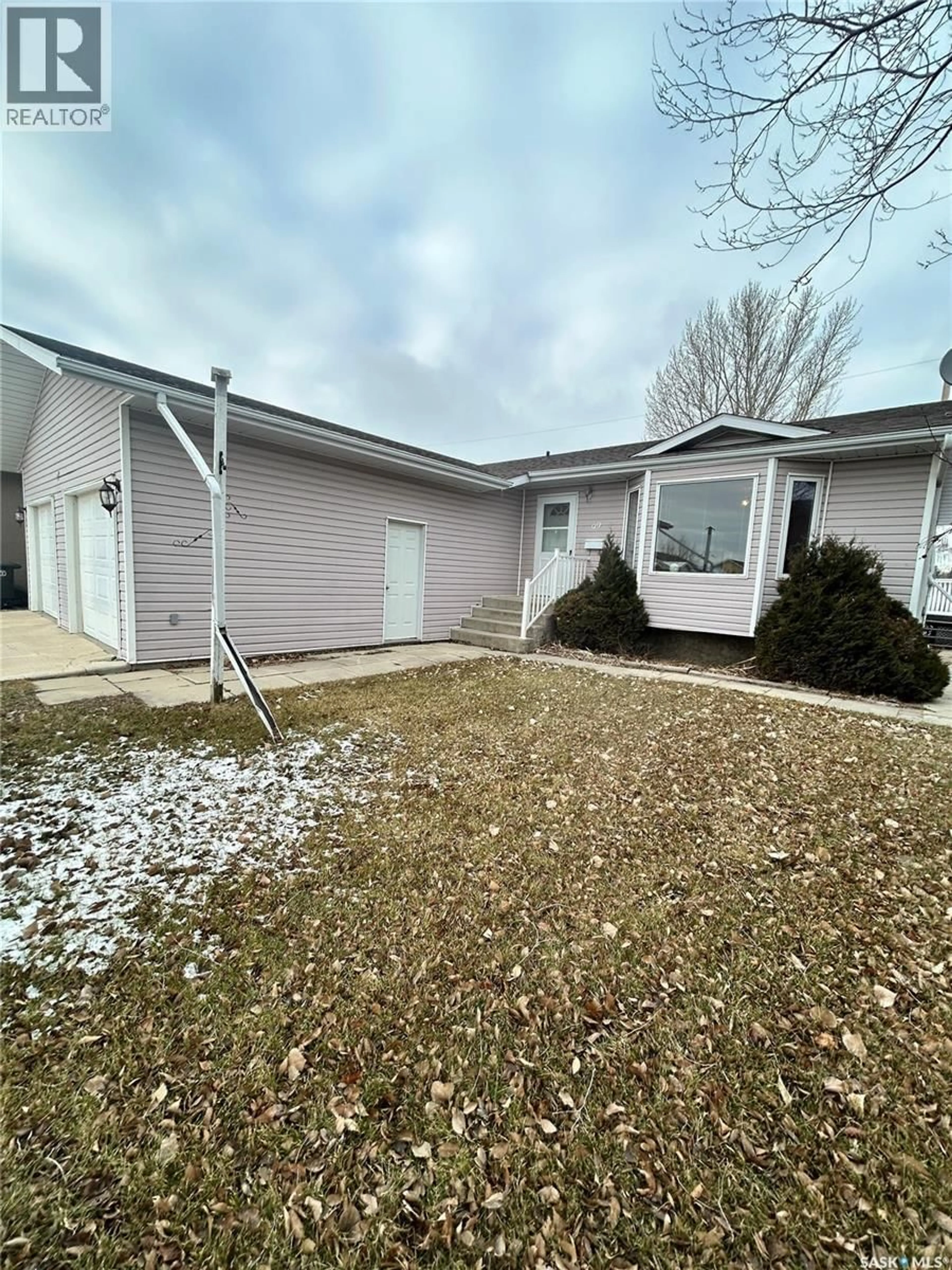 Home with vinyl exterior material, street for 99 LASKIN CRESCENT, Humboldt Saskatchewan S0K2A0