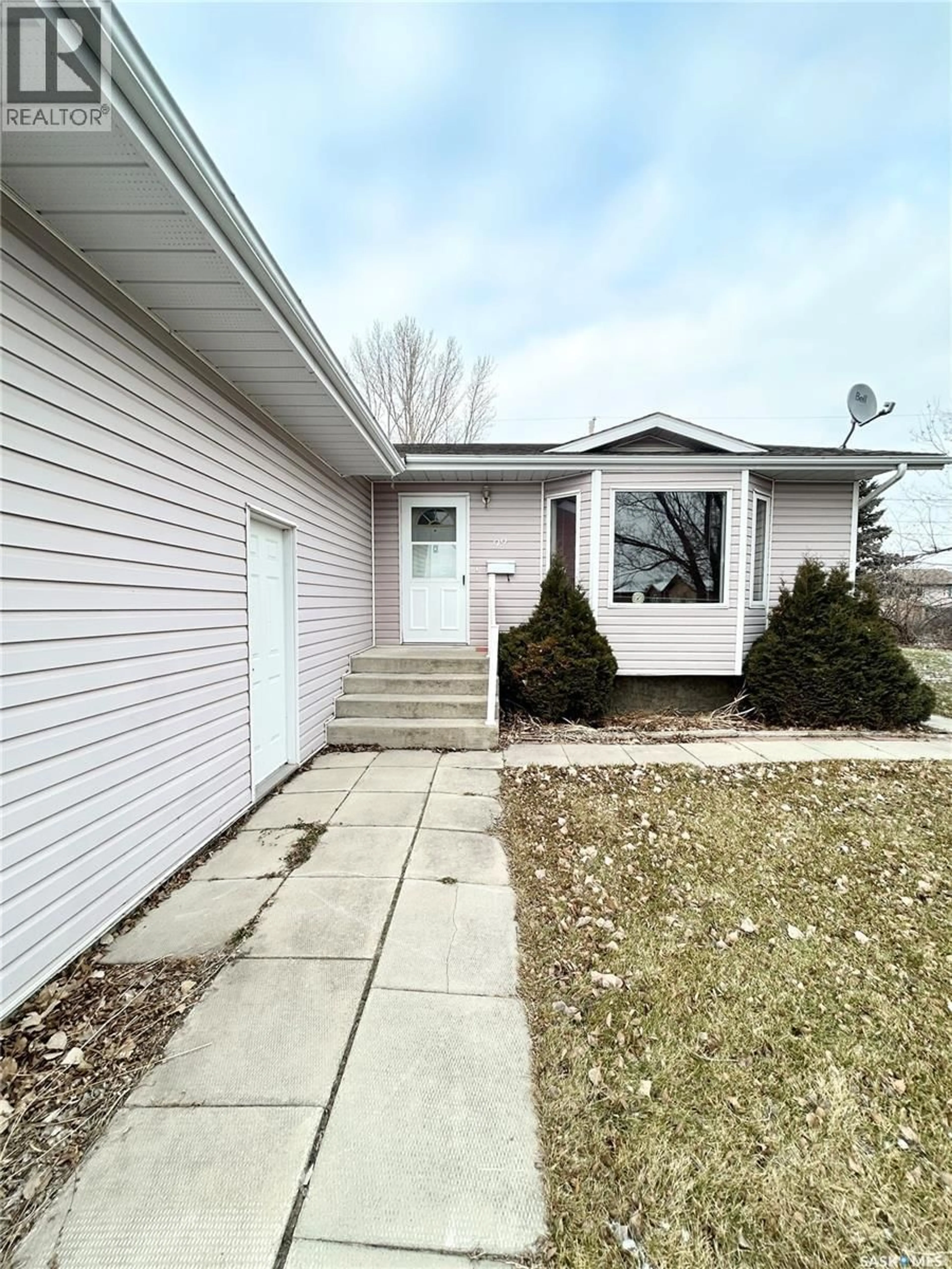 Home with vinyl exterior material, street for 99 LASKIN CRESCENT, Humboldt Saskatchewan S0K2A0