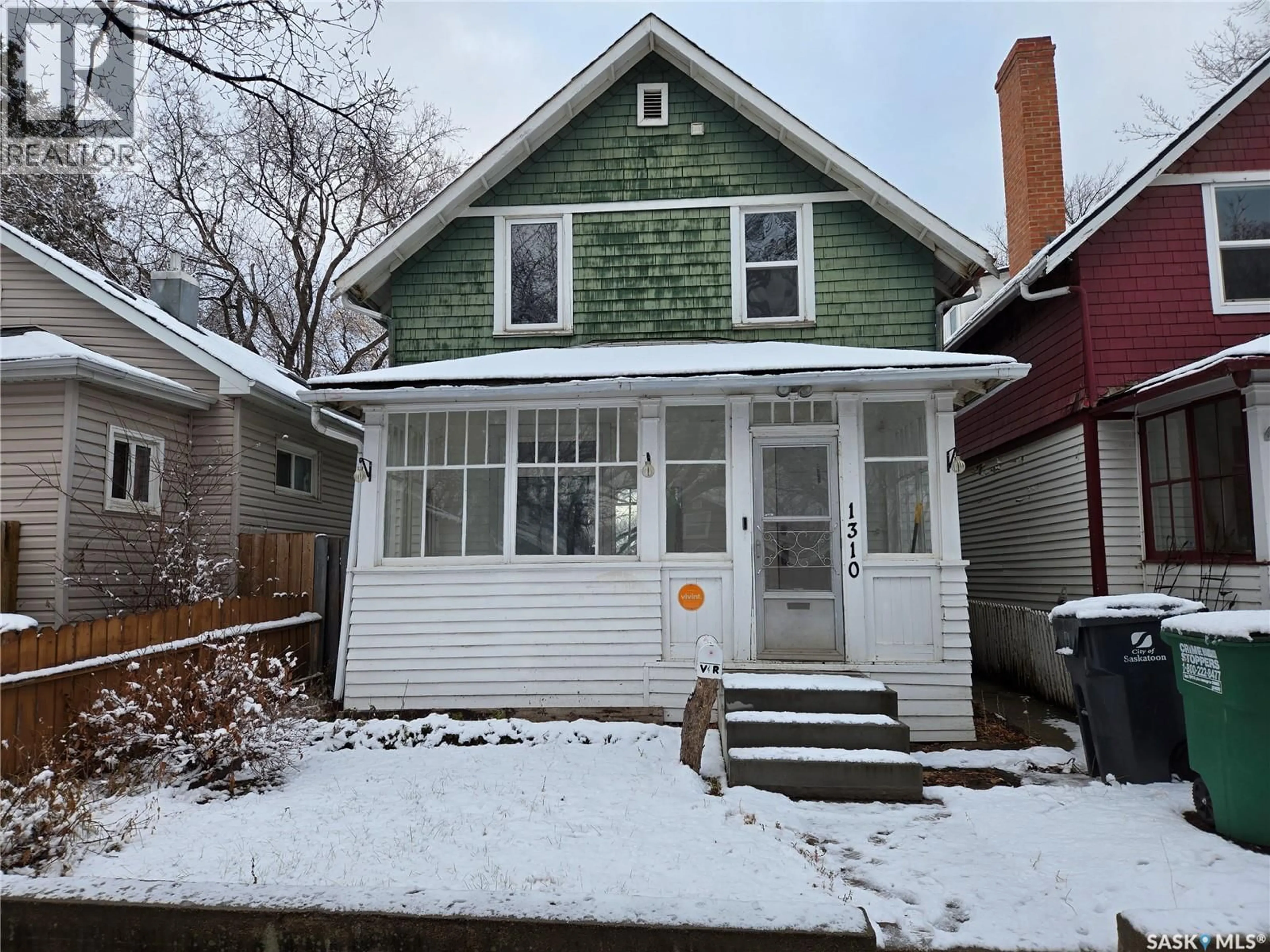 Home with vinyl exterior material, street for 1310 G AVENUE, Saskatoon Saskatchewan S7L2A7