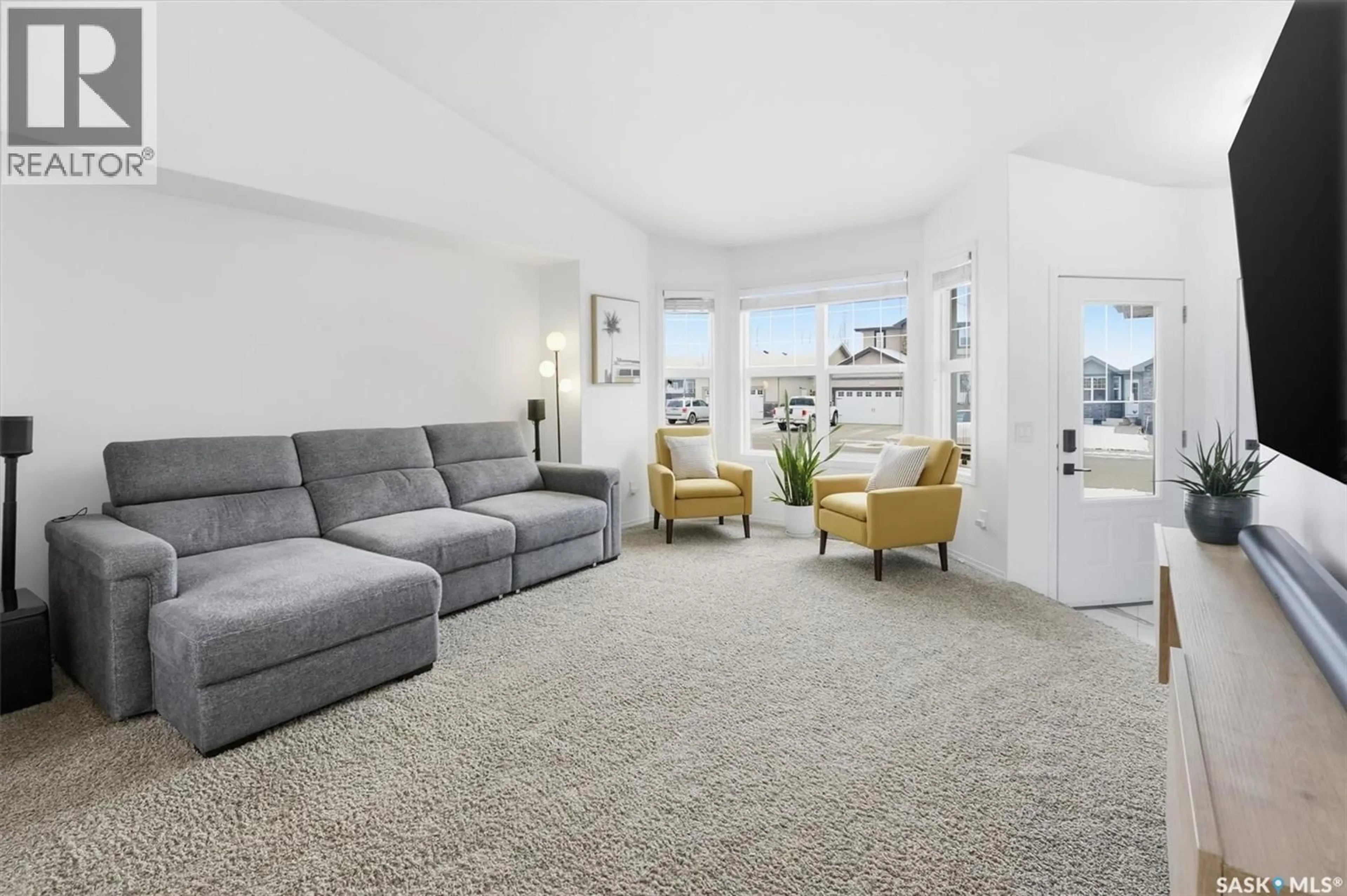 Living room with furniture, carpet floor for 1031 REMPEL WAY, Saskatoon Saskatchewan S7T0M4