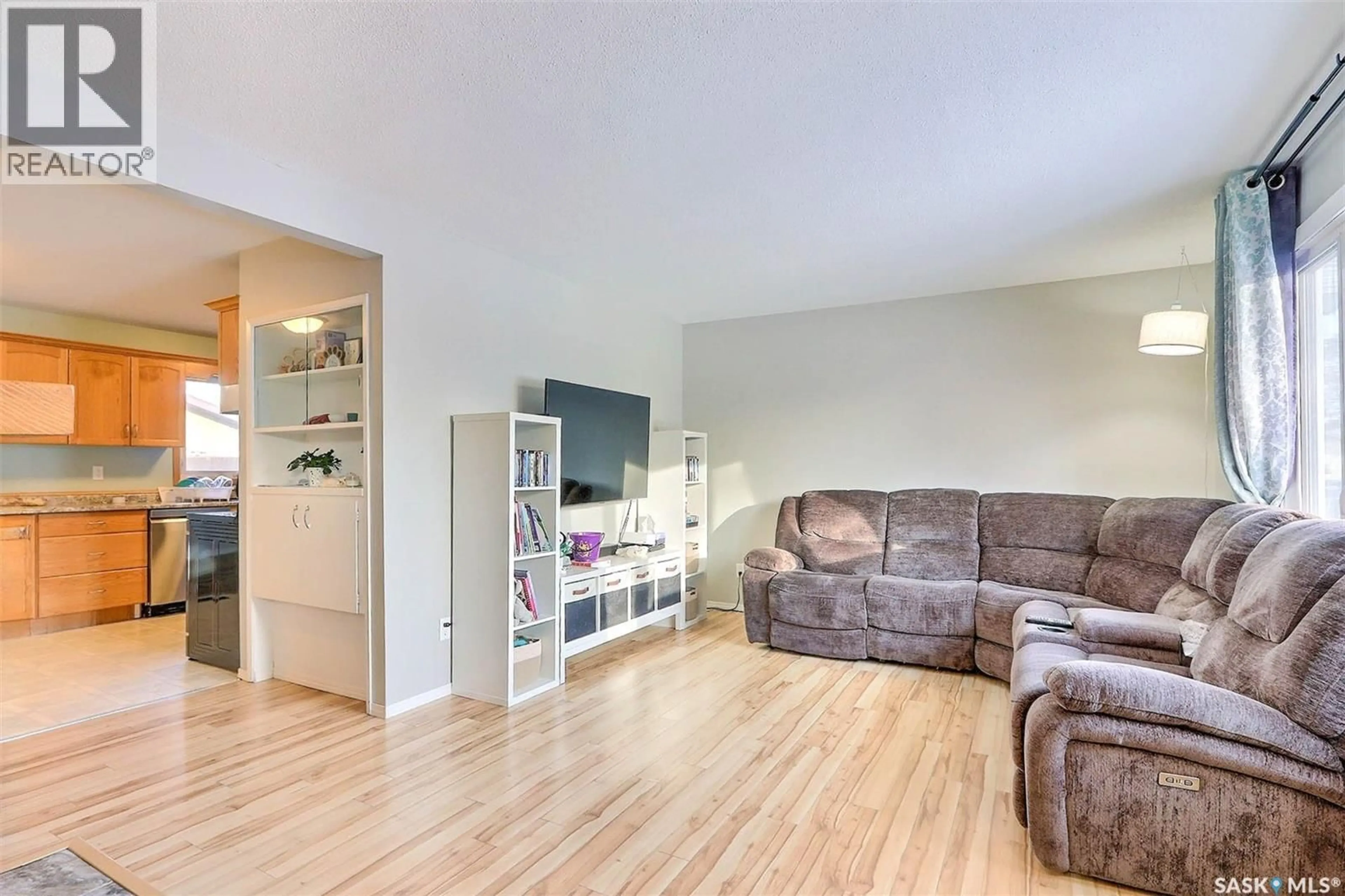 Living room with furniture, wood/laminate floor for 978 FRASER PLACE, Prince Albert Saskatchewan S6V2T7