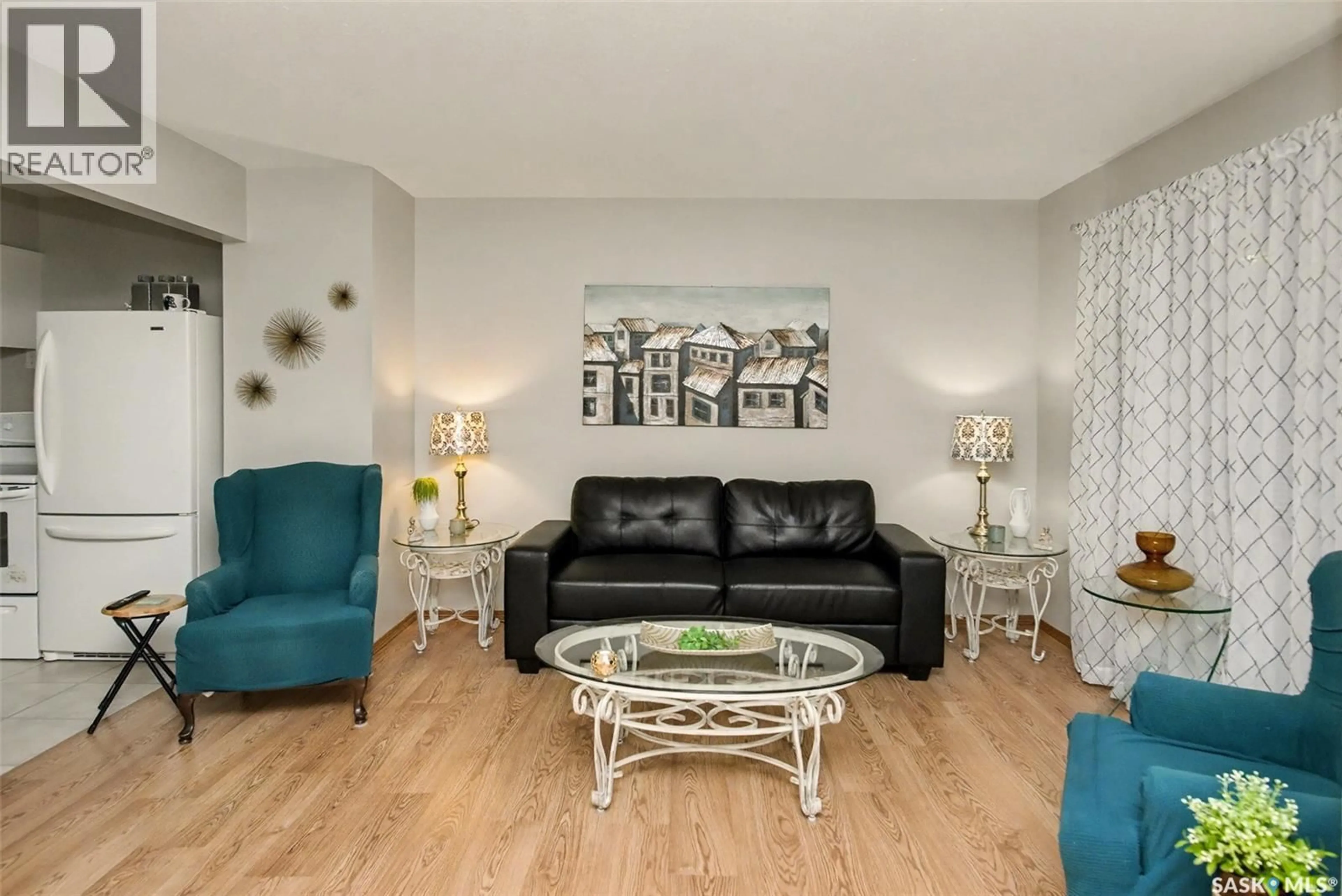 Living room with furniture, wood/laminate floor for 426 ROYAL STREET, Regina Saskatchewan S4R4Y6