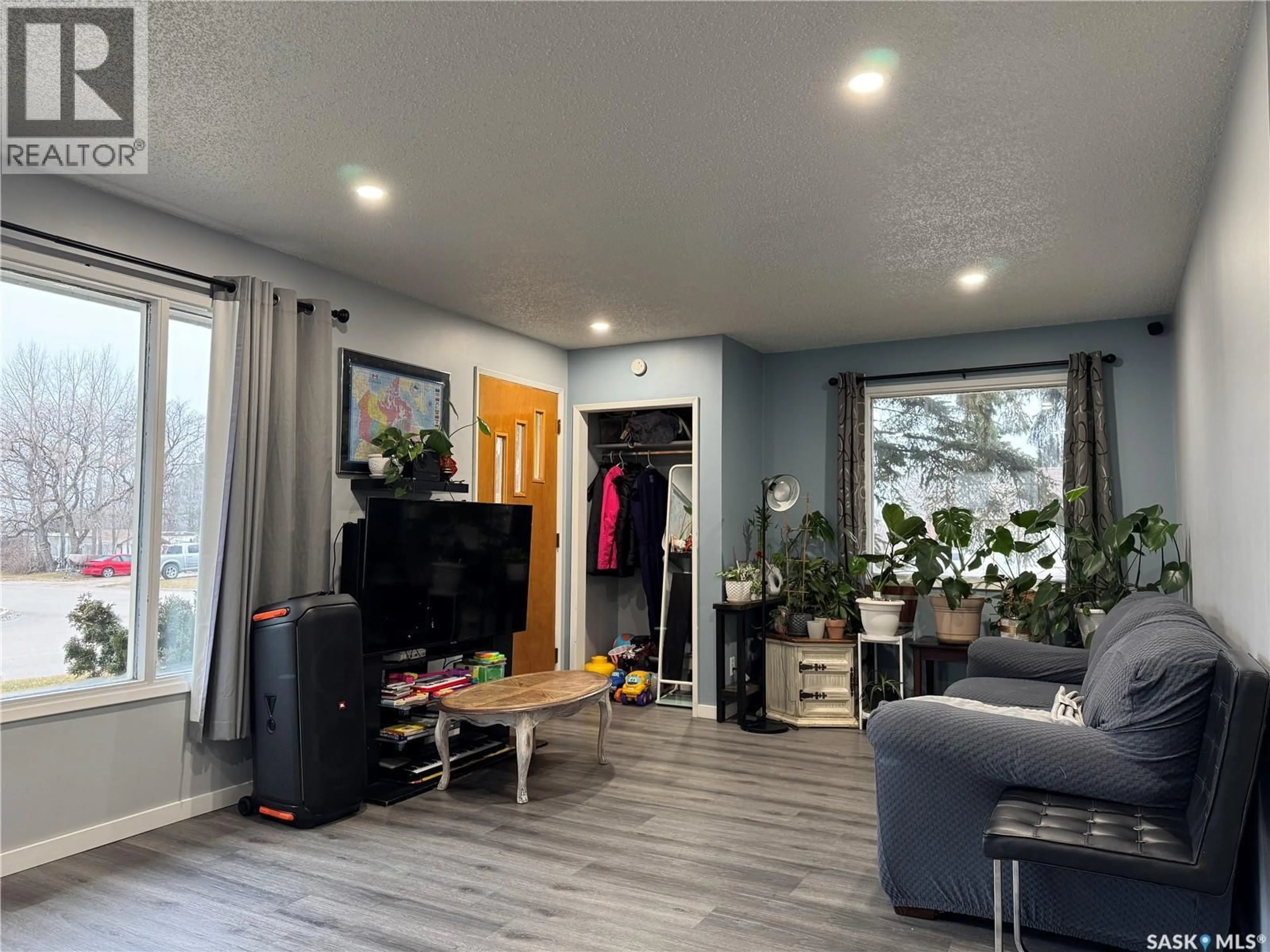 Living room with furniture, wood/laminate floor for 401 5TH STREET, Wynyard Saskatchewan S0A4T0