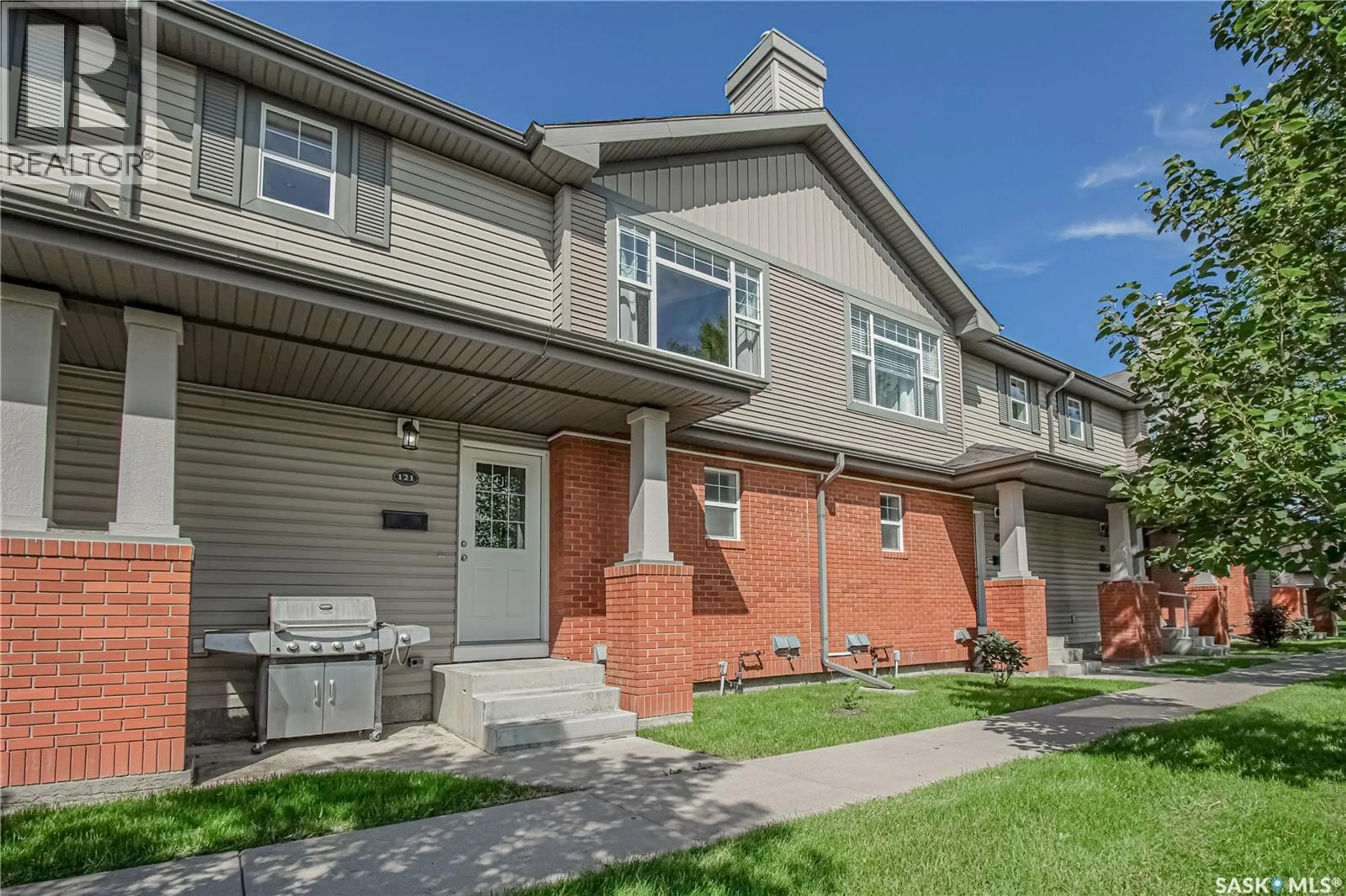 Home with brick exterior material, street for 410 - 121 STENSRUD ROAD, Saskatoon Saskatchewan S7W0B7