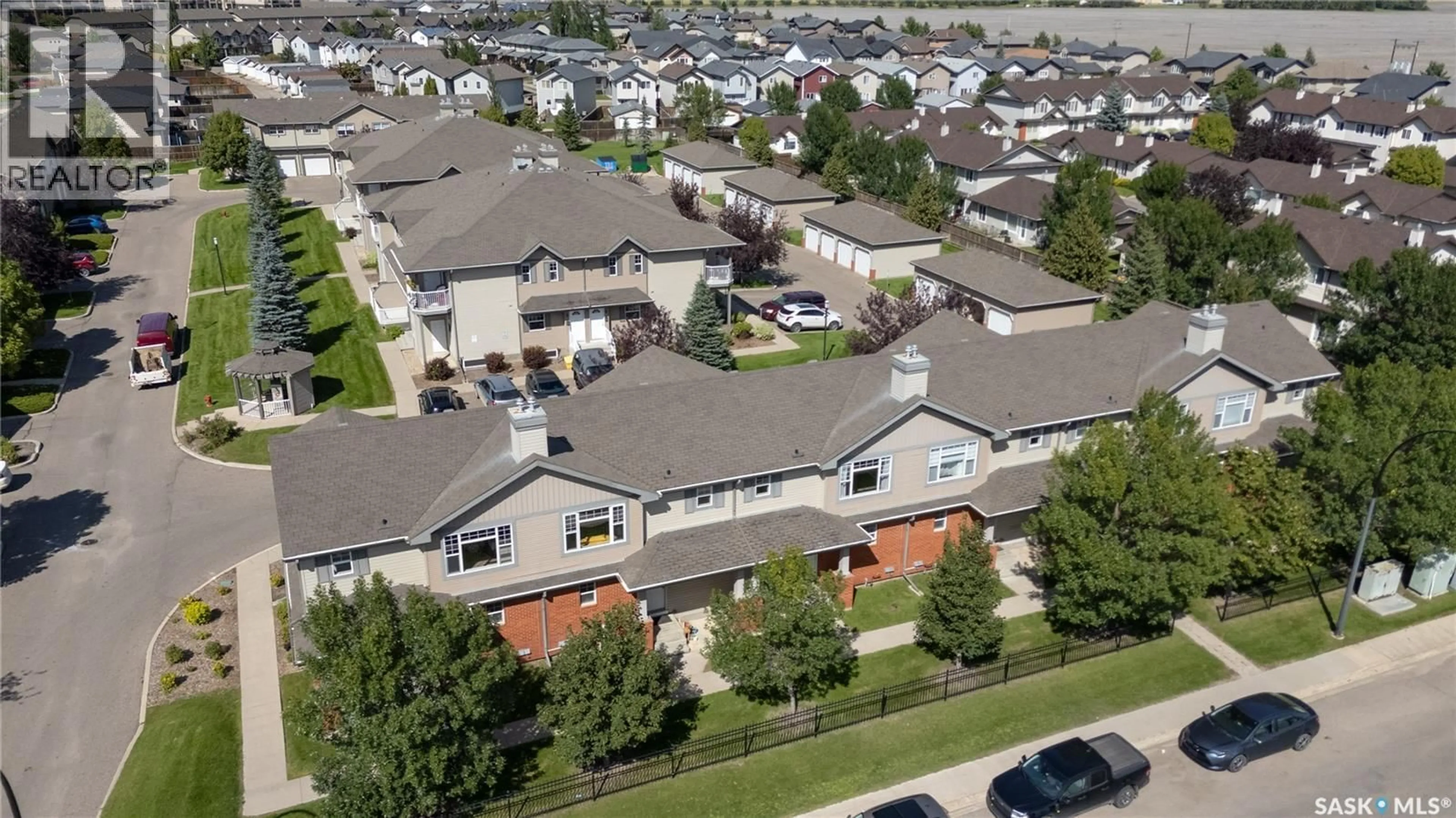 A pic from outside/outdoor area/front of a property/back of a property/a pic from drone, unknown for 410 - 121 STENSRUD ROAD, Saskatoon Saskatchewan S7W0B7