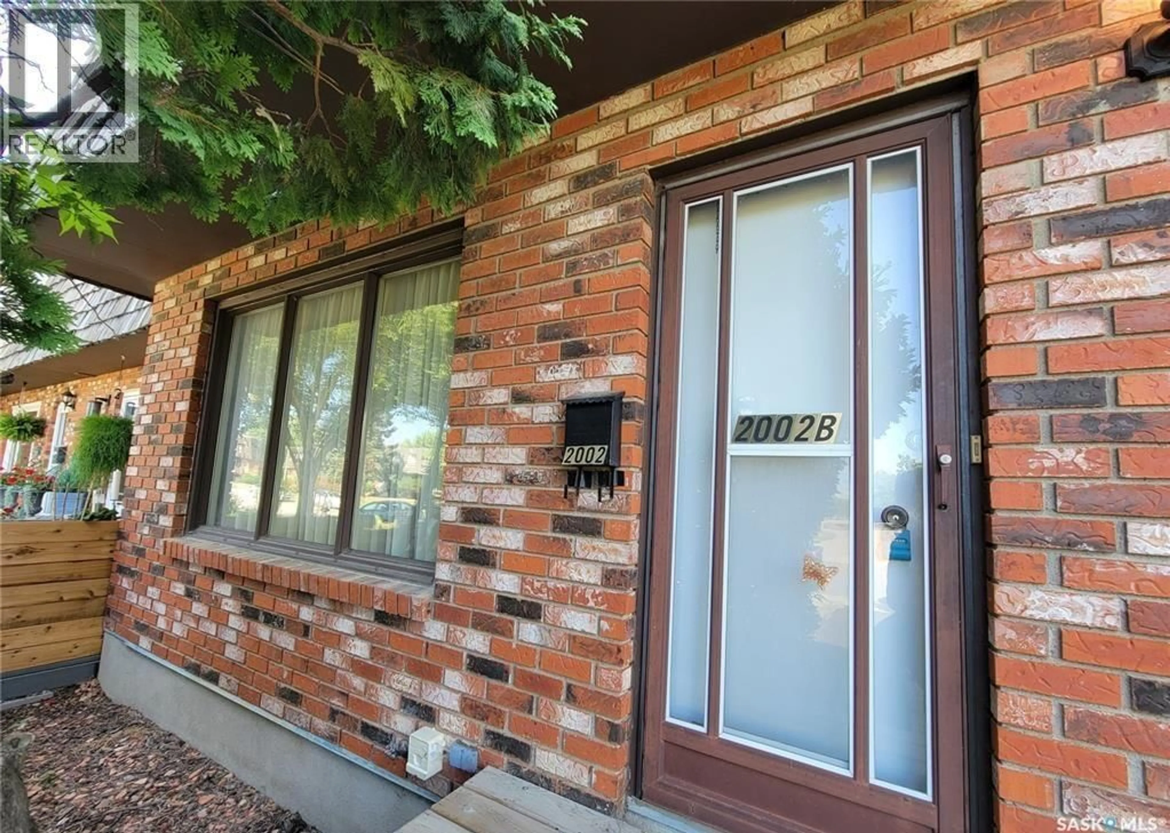 Home with brick exterior material, street for B - 2002 FOLEY DRIVE, North Battleford Saskatchewan S9A3G9