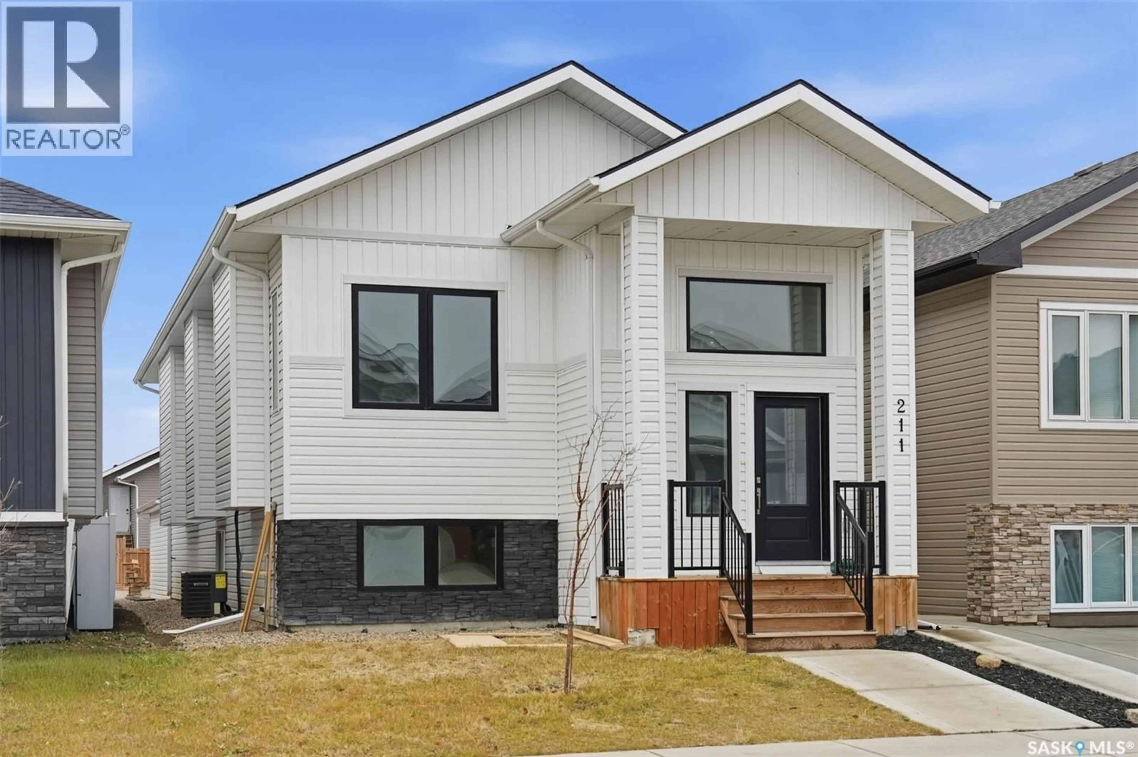 Home with brick exterior material, street for 211 THAKUR STREET, Saskatoon Saskatchewan S7W0Z9