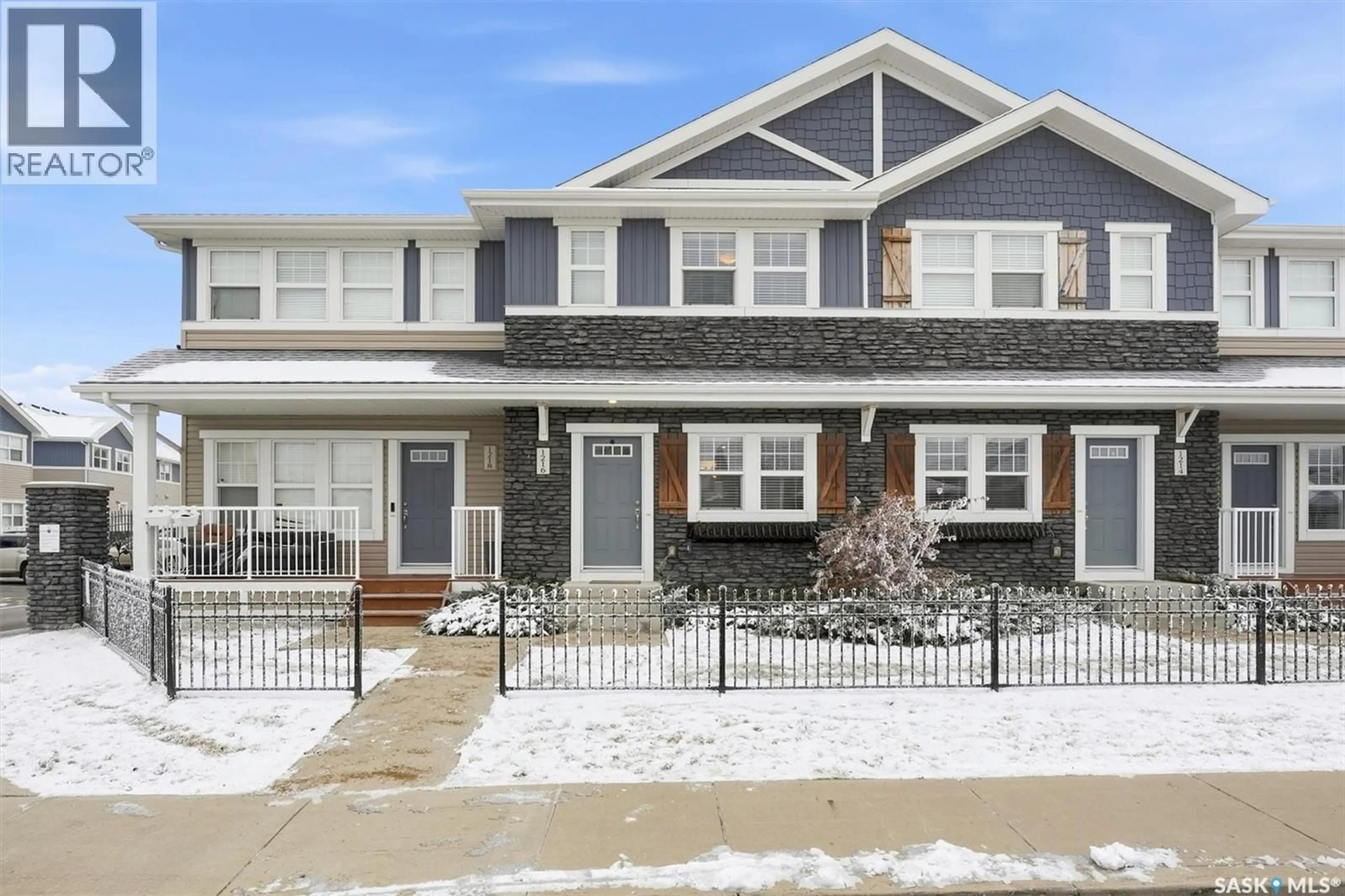 Home with vinyl exterior material, street for 1216 PRINGLE WAY, Saskatoon Saskatchewan S7T0X5