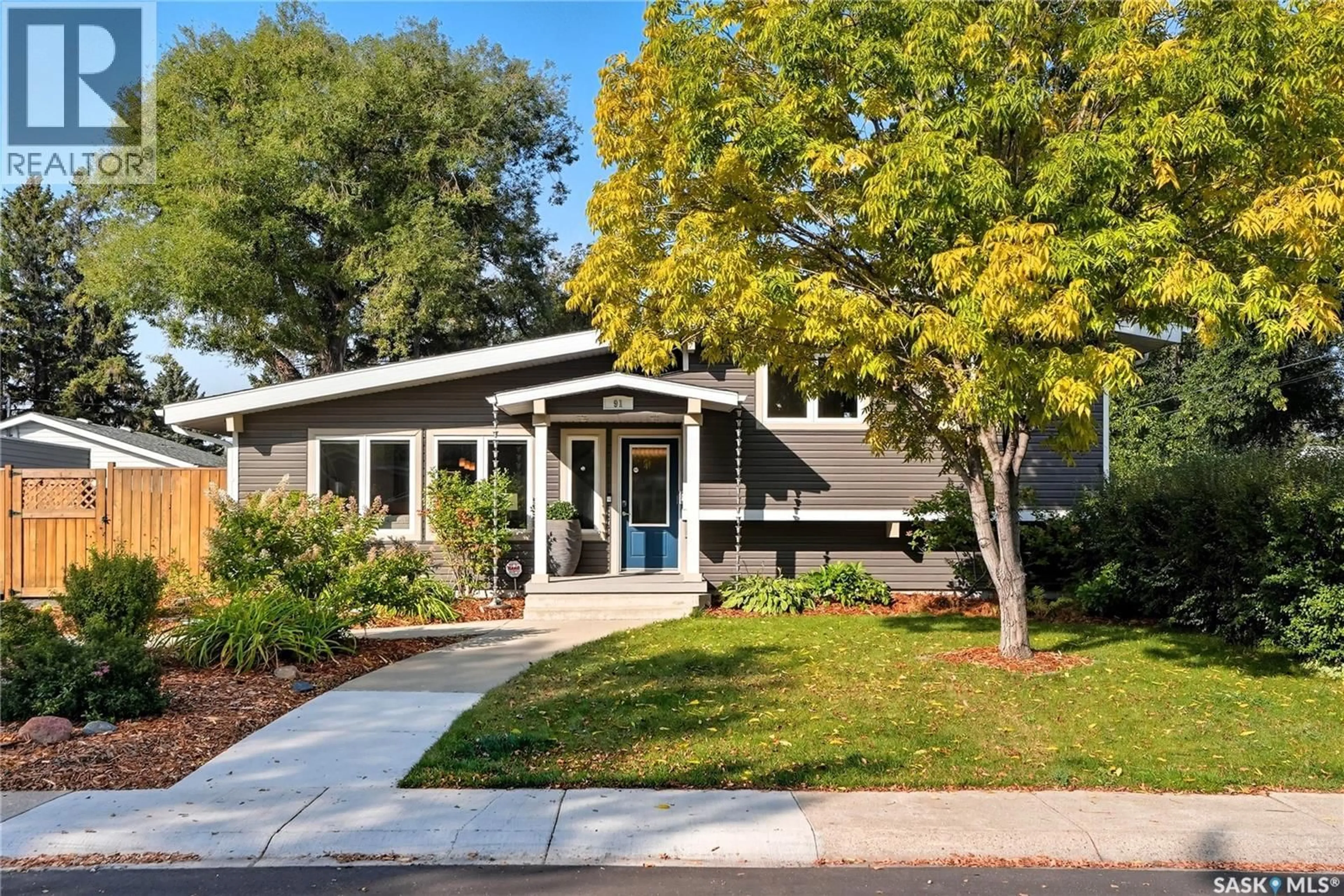 Home with vinyl exterior material, street for 91 LINDSAY DRIVE, Saskatoon Saskatchewan S7H3E4