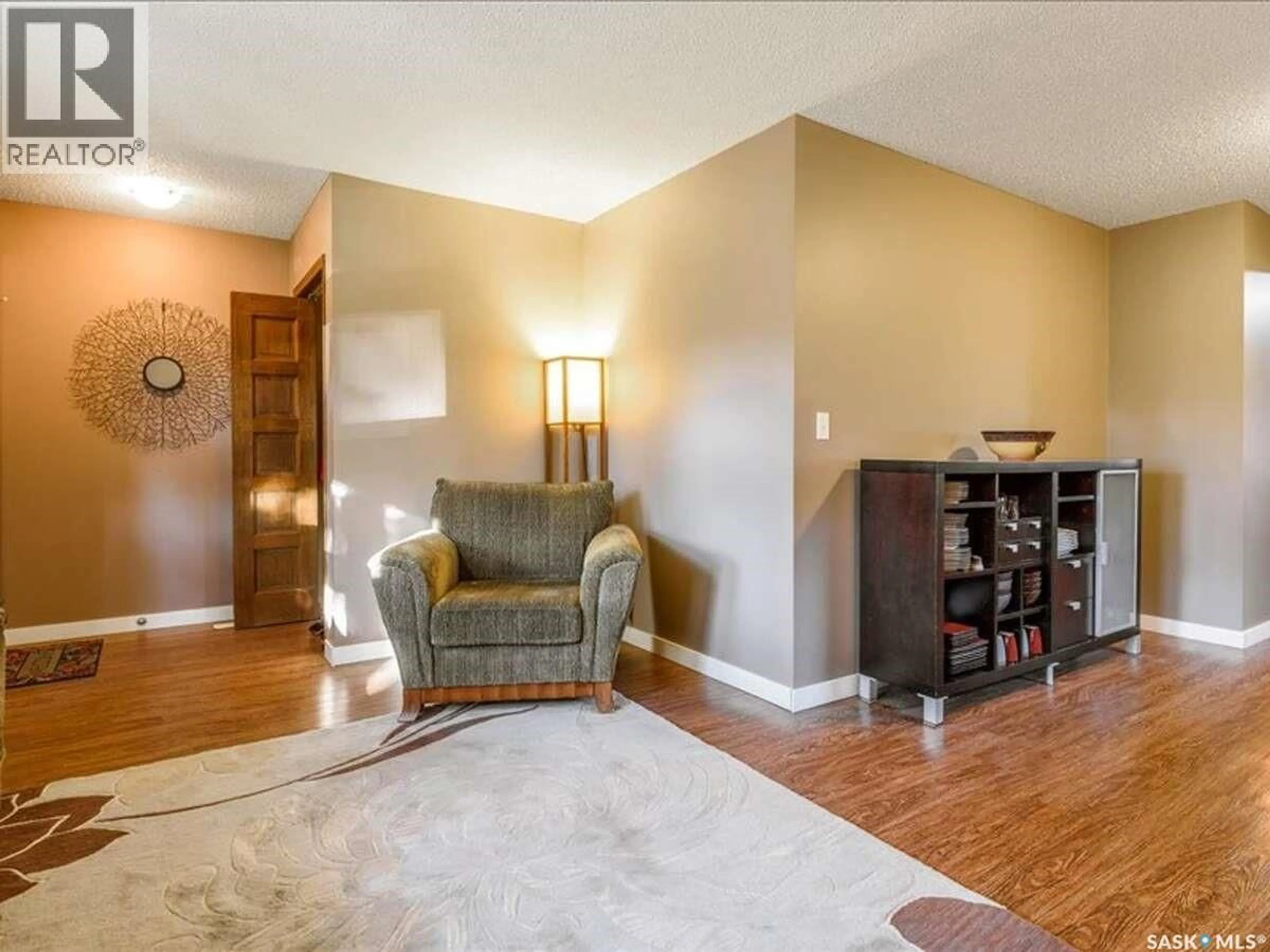 Living room with furniture, wood/laminate floor for 2529 ATKINSON STREET, Regina Saskatchewan S4N3X8