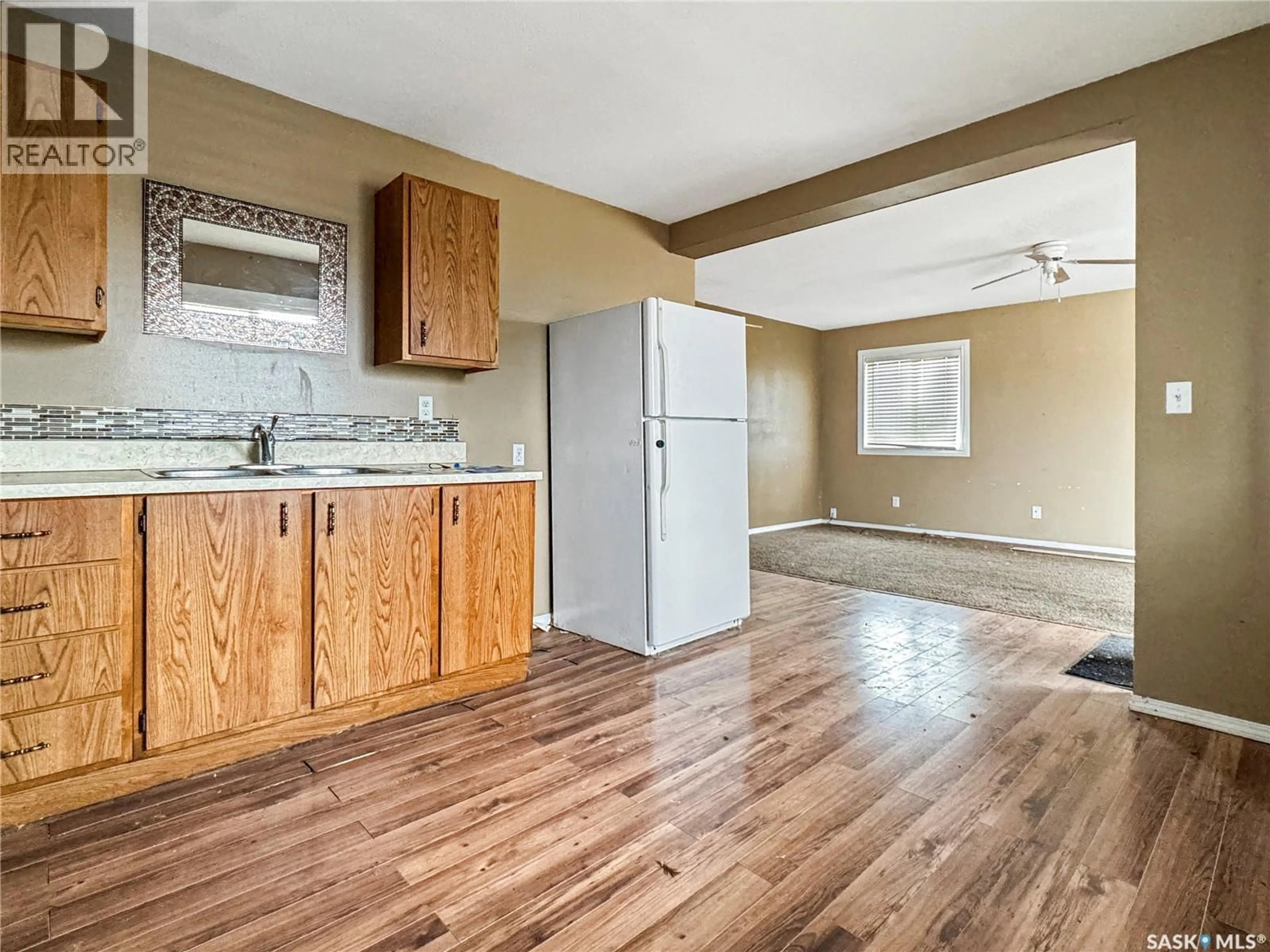 Open concept kitchen, wood/laminate floor for 406 BIRCH DRIVE, Maidstone Saskatchewan S0M1M0