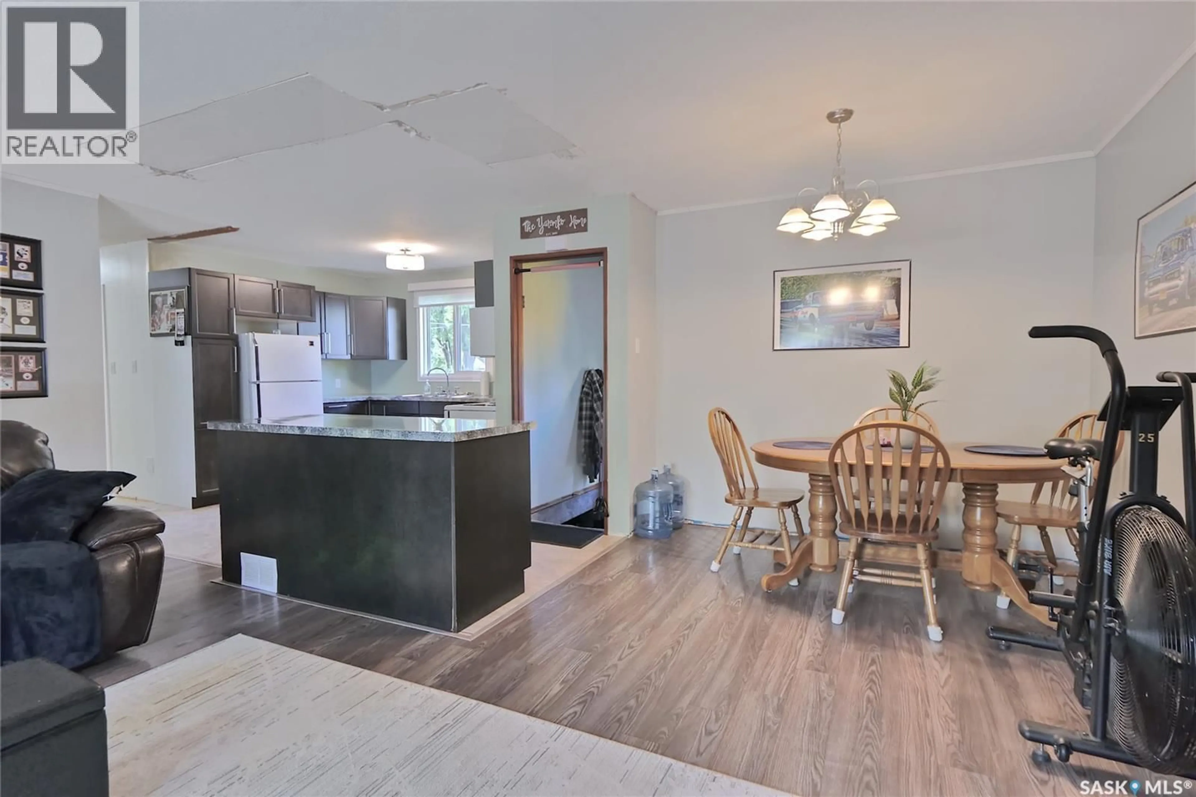 Open concept kitchen, wood/laminate floor for 606 6TH STREET, Chaplin Saskatchewan S0H0V0