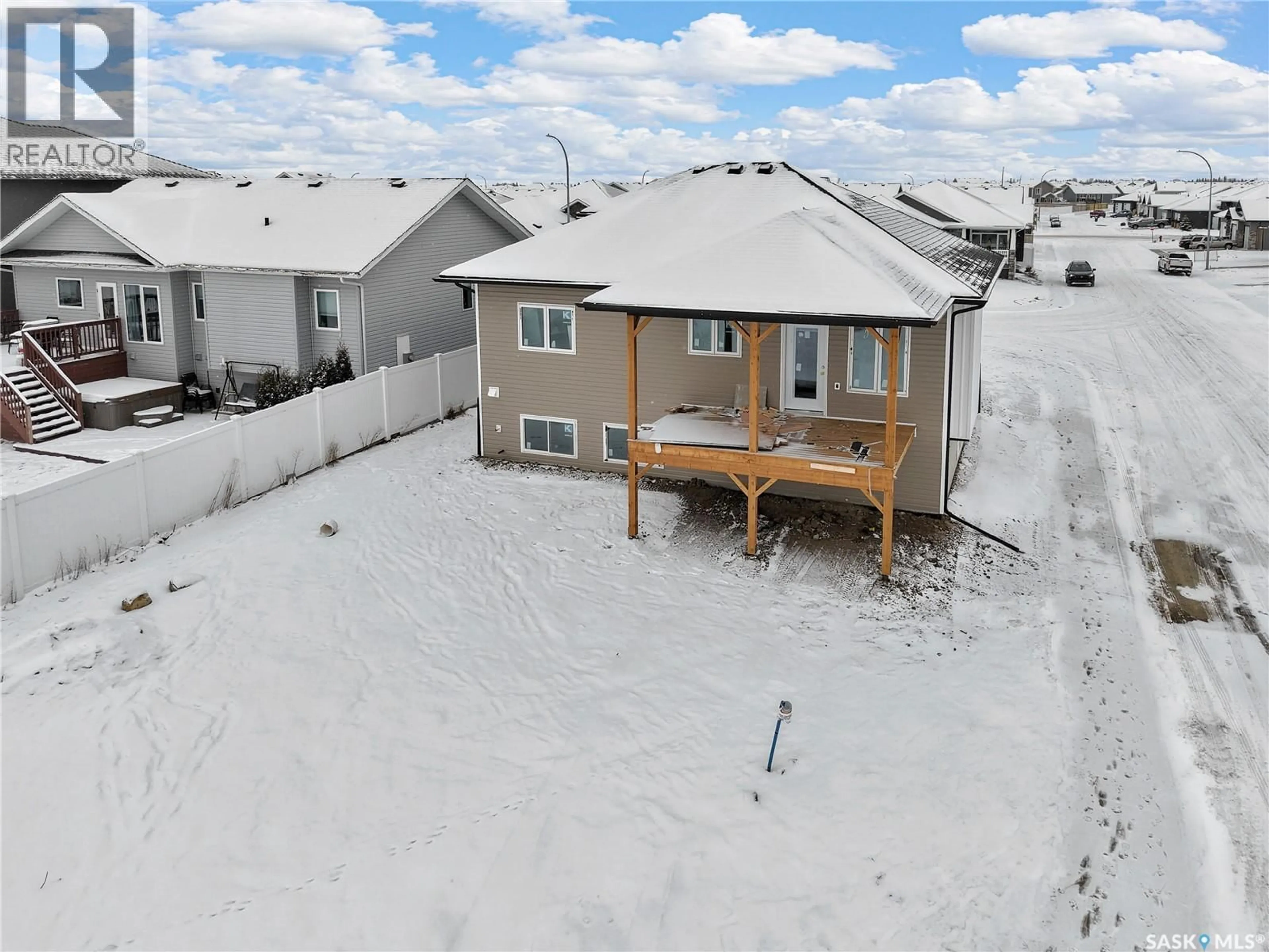A pic from outside/outdoor area/front of a property/back of a property/a pic from drone, water/lake/river/ocean view for 614 CASPER COVE, Warman Saskatchewan S0K4S4