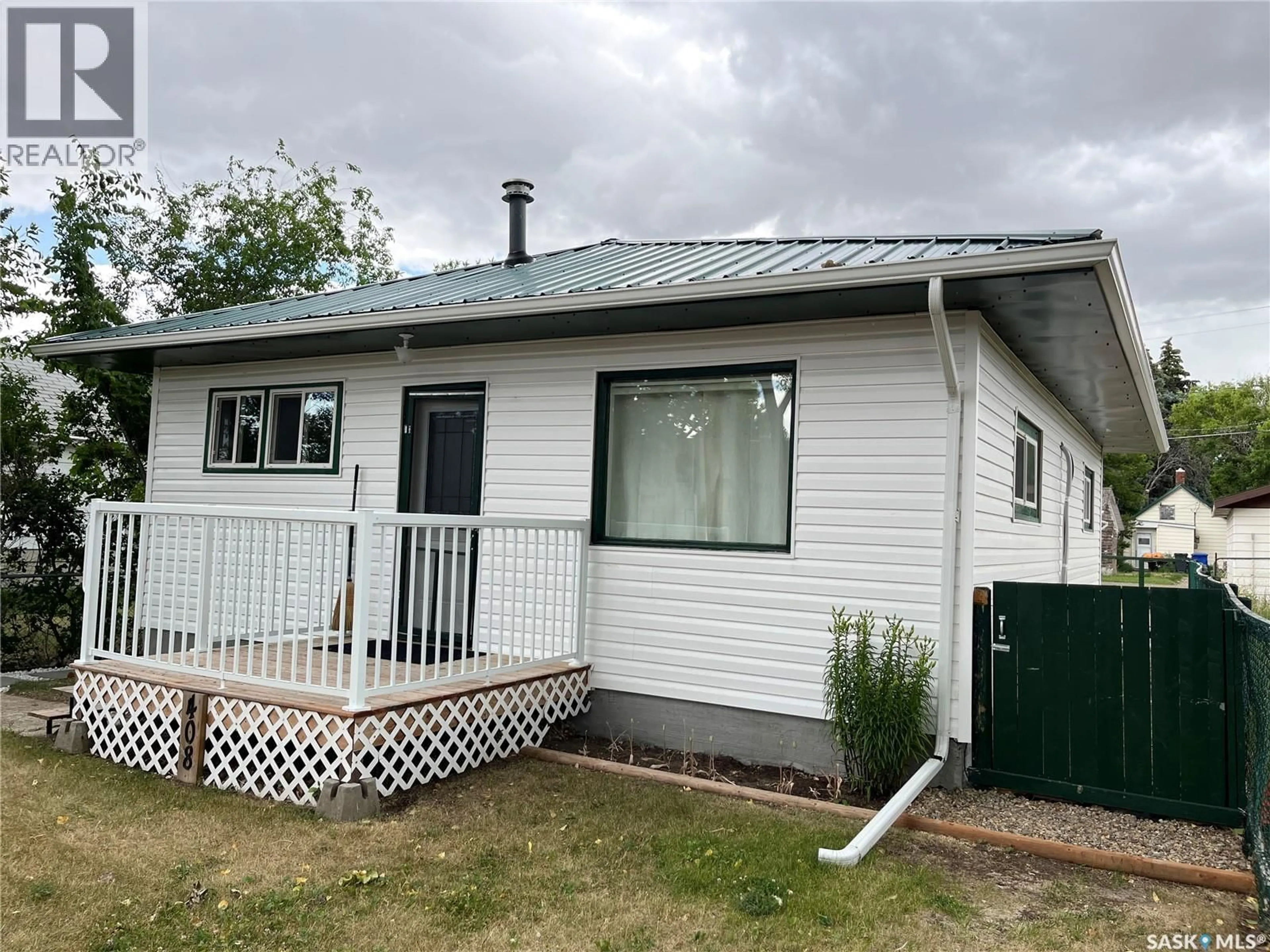 Home with vinyl exterior material, street for 408 MAPLE STREET, Maple Creek Saskatchewan S0N1N0