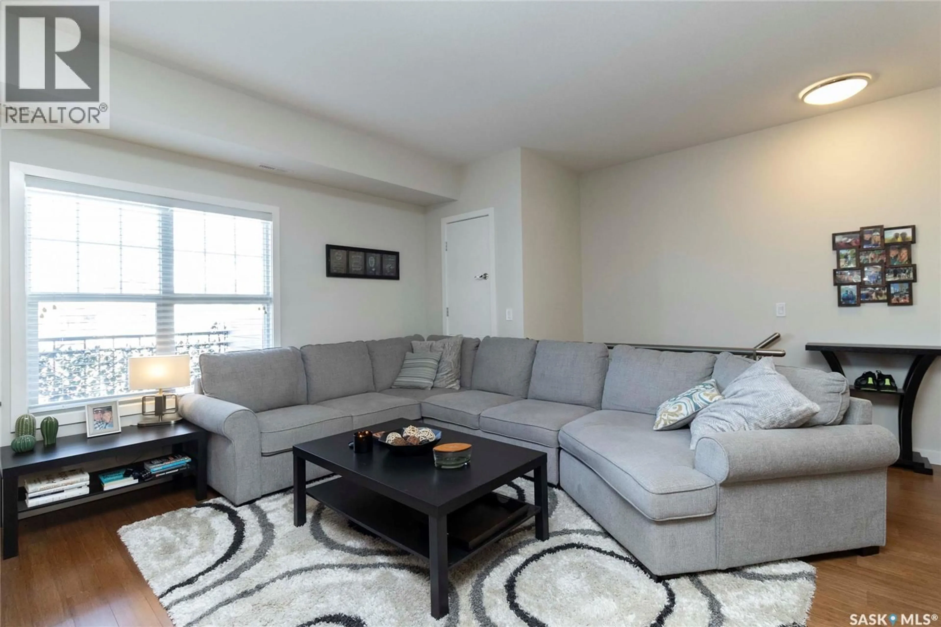 Living room with furniture, carpet floor for 1015 - 2208 PATRICK CRESCENT, Saskatoon Saskatchewan S7W0M1