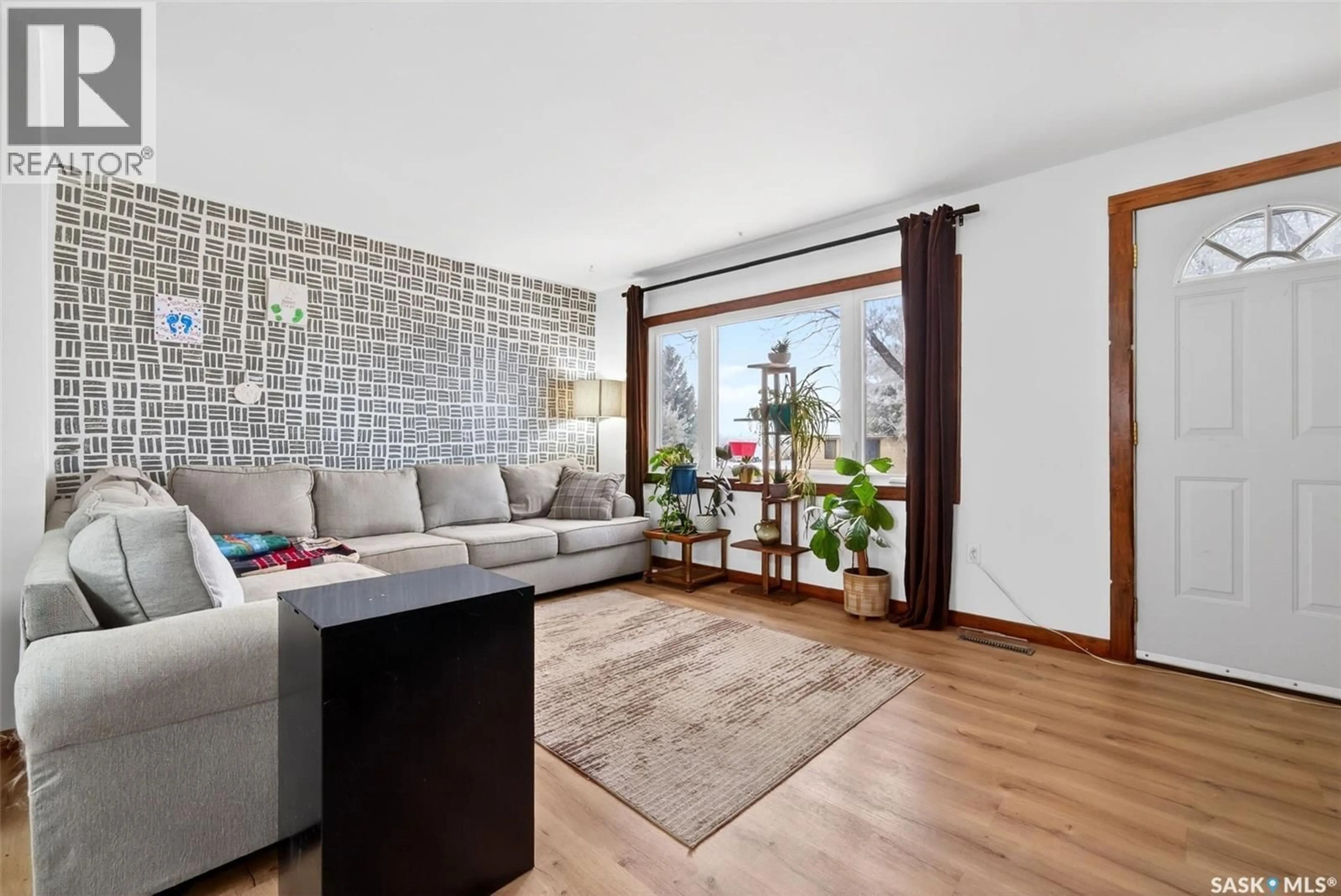 Living room with furniture, wood/laminate floor for 117 3RD STREET, Drinkwater Saskatchewan S0H1G0