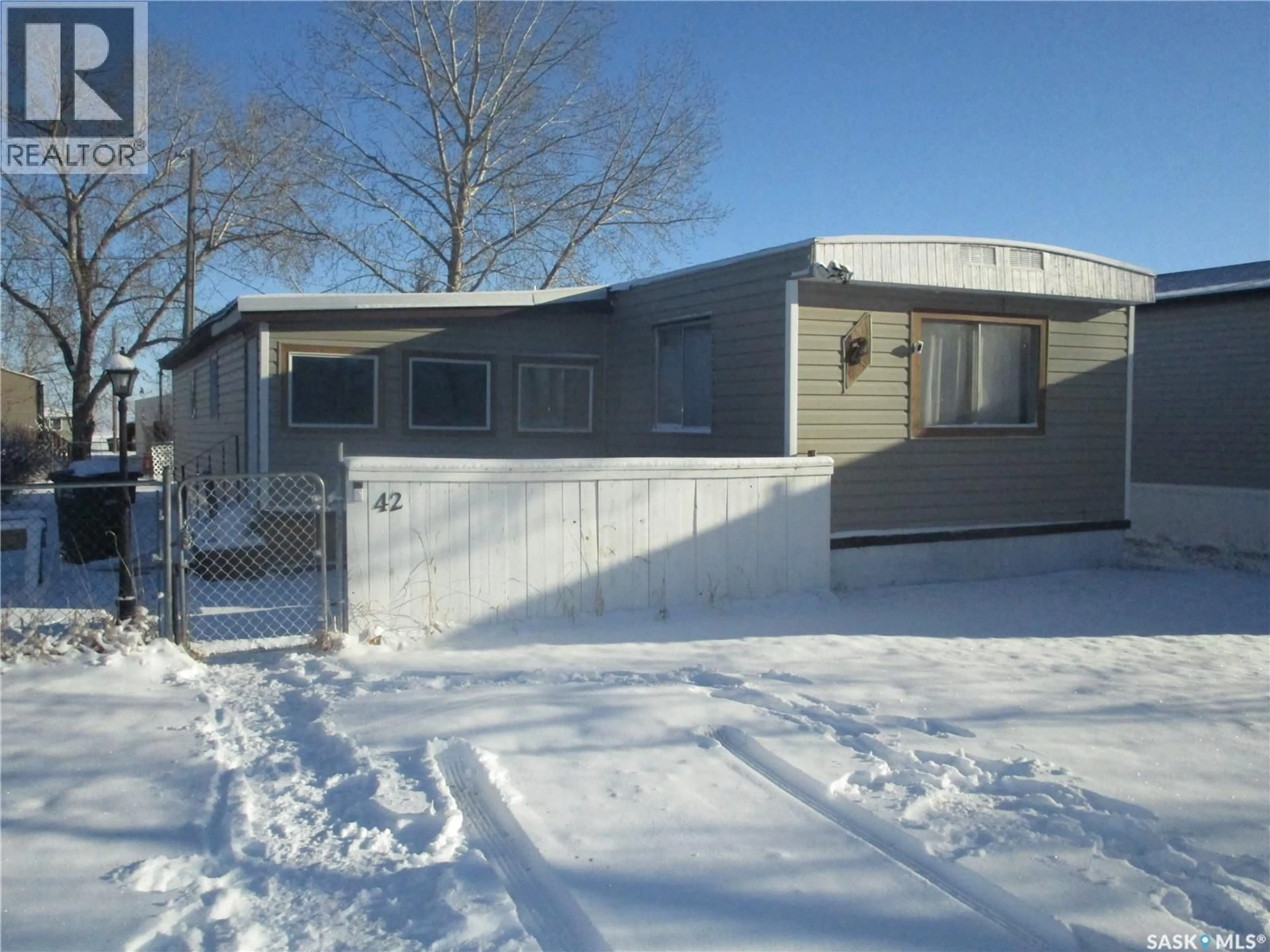 Home with vinyl exterior material, street for 42 SUNRISE ESTATES, Assiniboia Saskatchewan S0H0B0