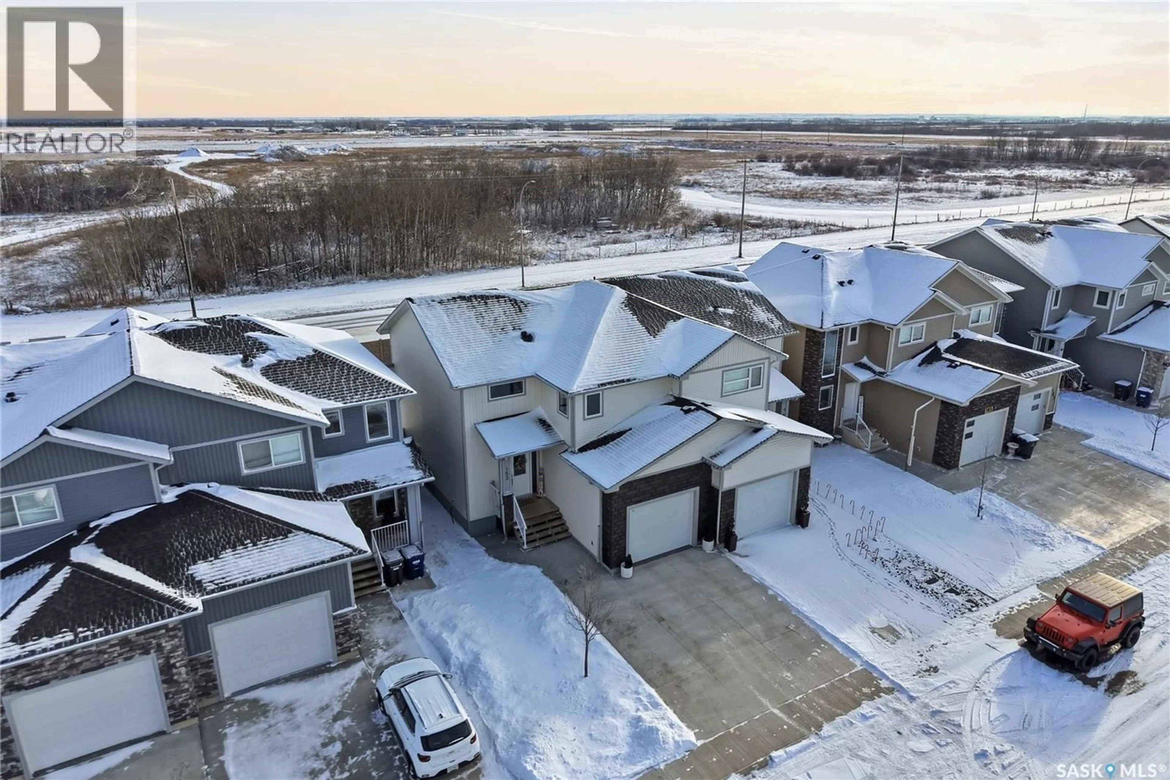 A pic from outside/outdoor area/front of a property/back of a property/a pic from drone, unknown for 153 ECHO LANE, Martensville Saskatchewan S0K2T1