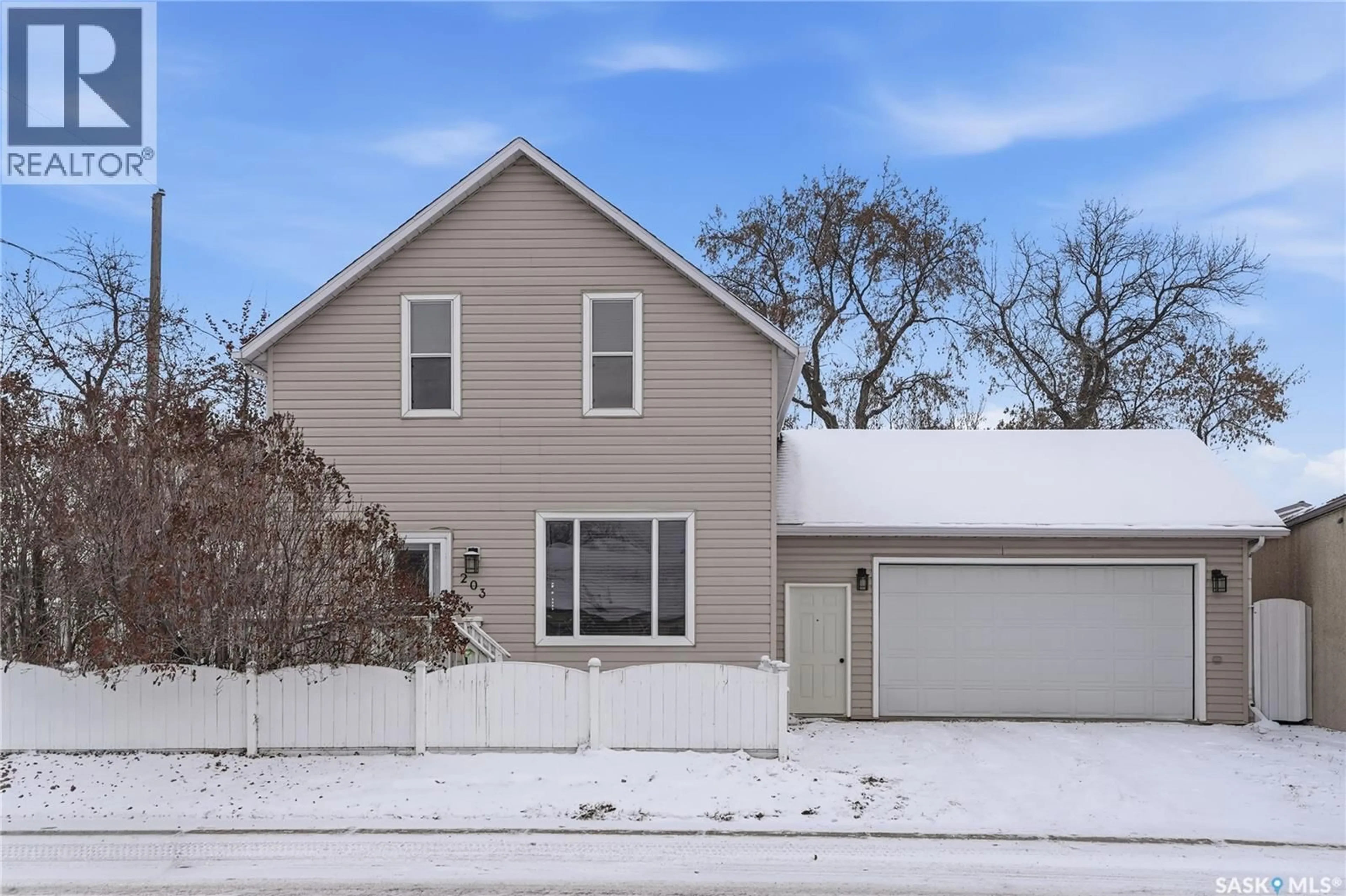 Home with vinyl exterior material, street for 203 6TH AVENUE, Warman Saskatchewan S0K4S3