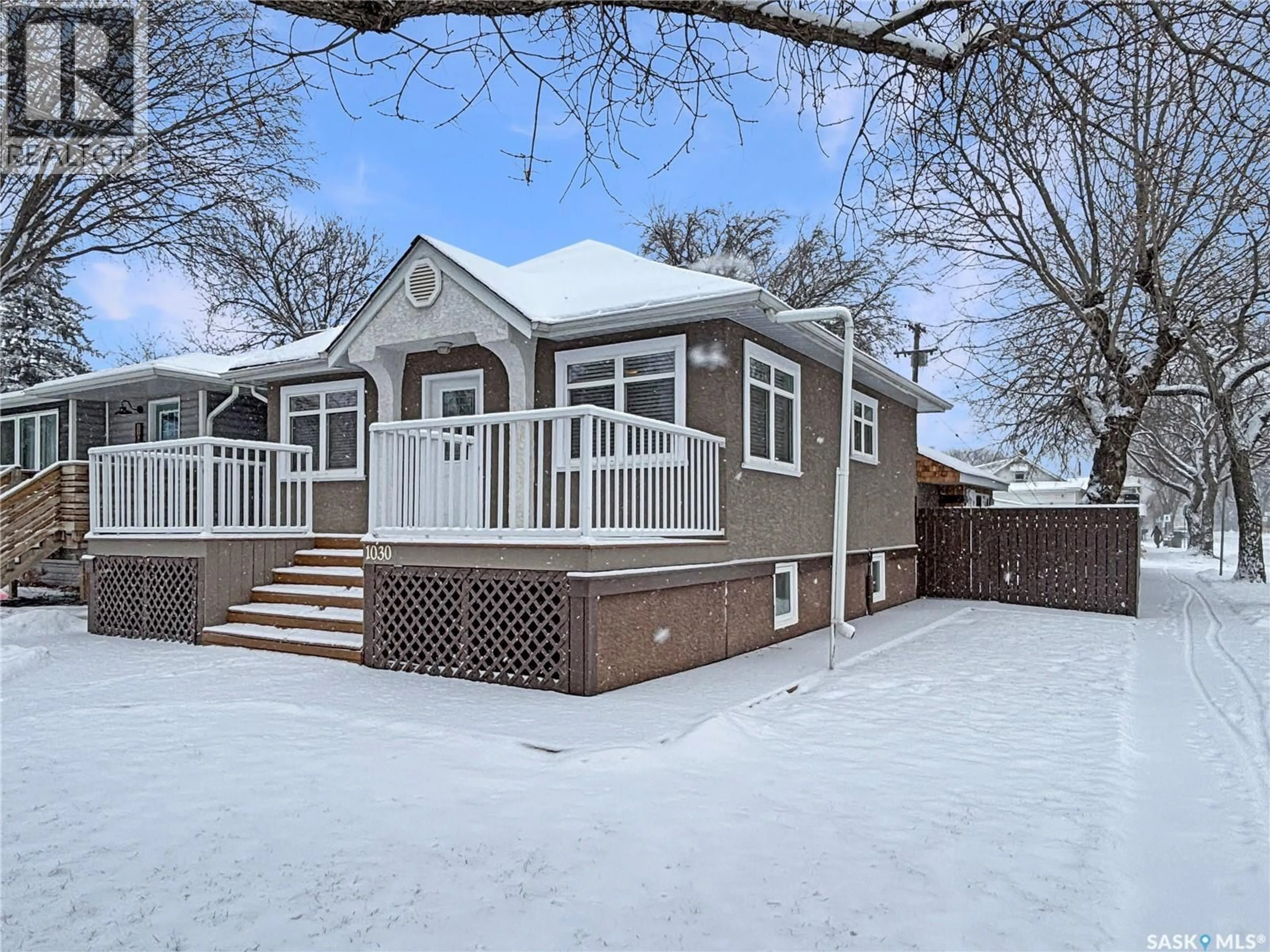 Home with vinyl exterior material, street for 1030 M AVENUE, Saskatoon Saskatchewan S7M2L9