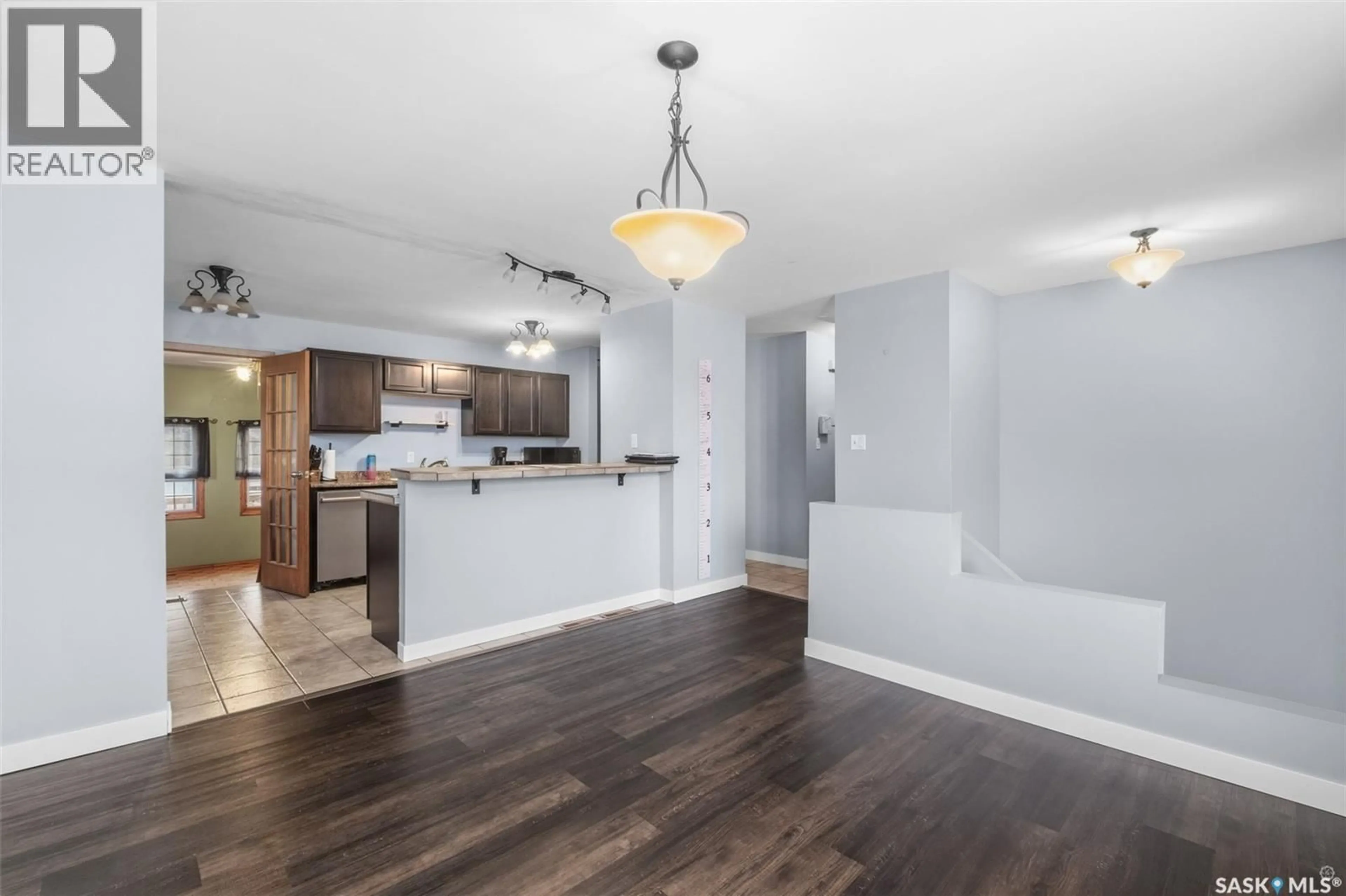 Open concept kitchen, wood/laminate floor for 448 15TH AVENUE, Prince Albert Saskatchewan S6V2N9
