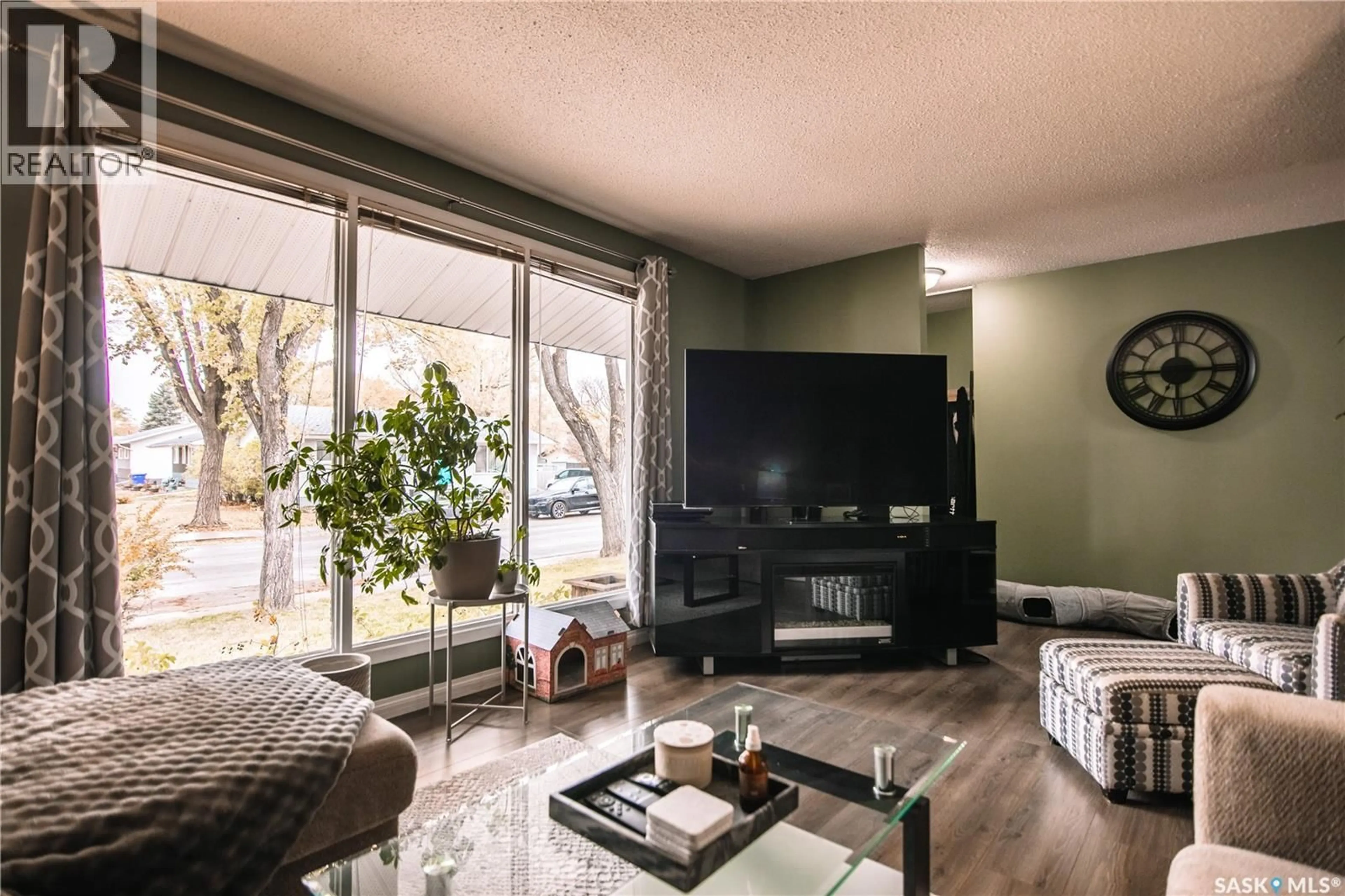 Living room with furniture, wood/laminate floor for 132 NAGEL CRESCENT, Regina Saskatchewan S4N1N9