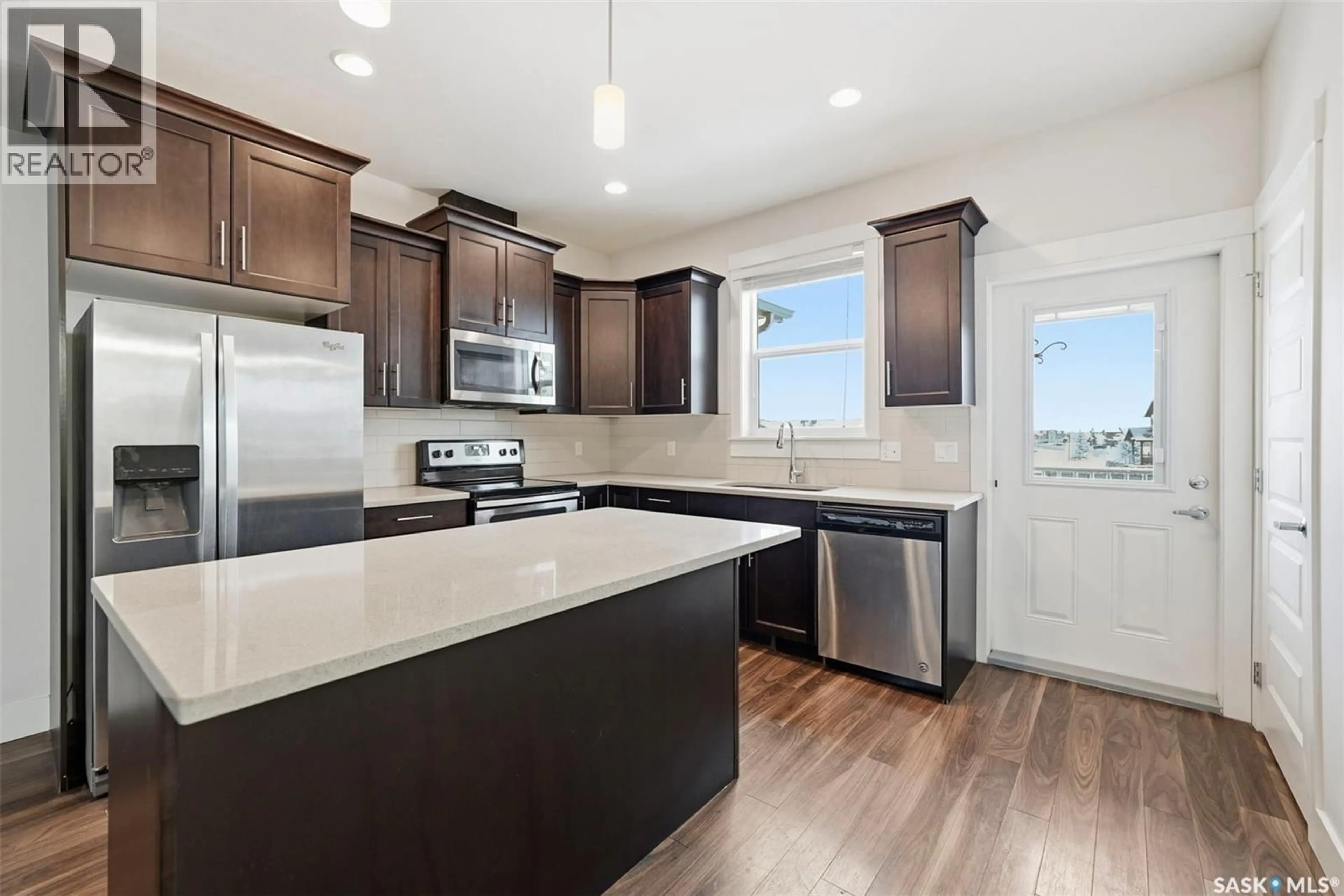 Open concept kitchen, ceramic/tile floor for 8 900 ST ANDREWS LANE, Warman Saskatchewan S0K4S4