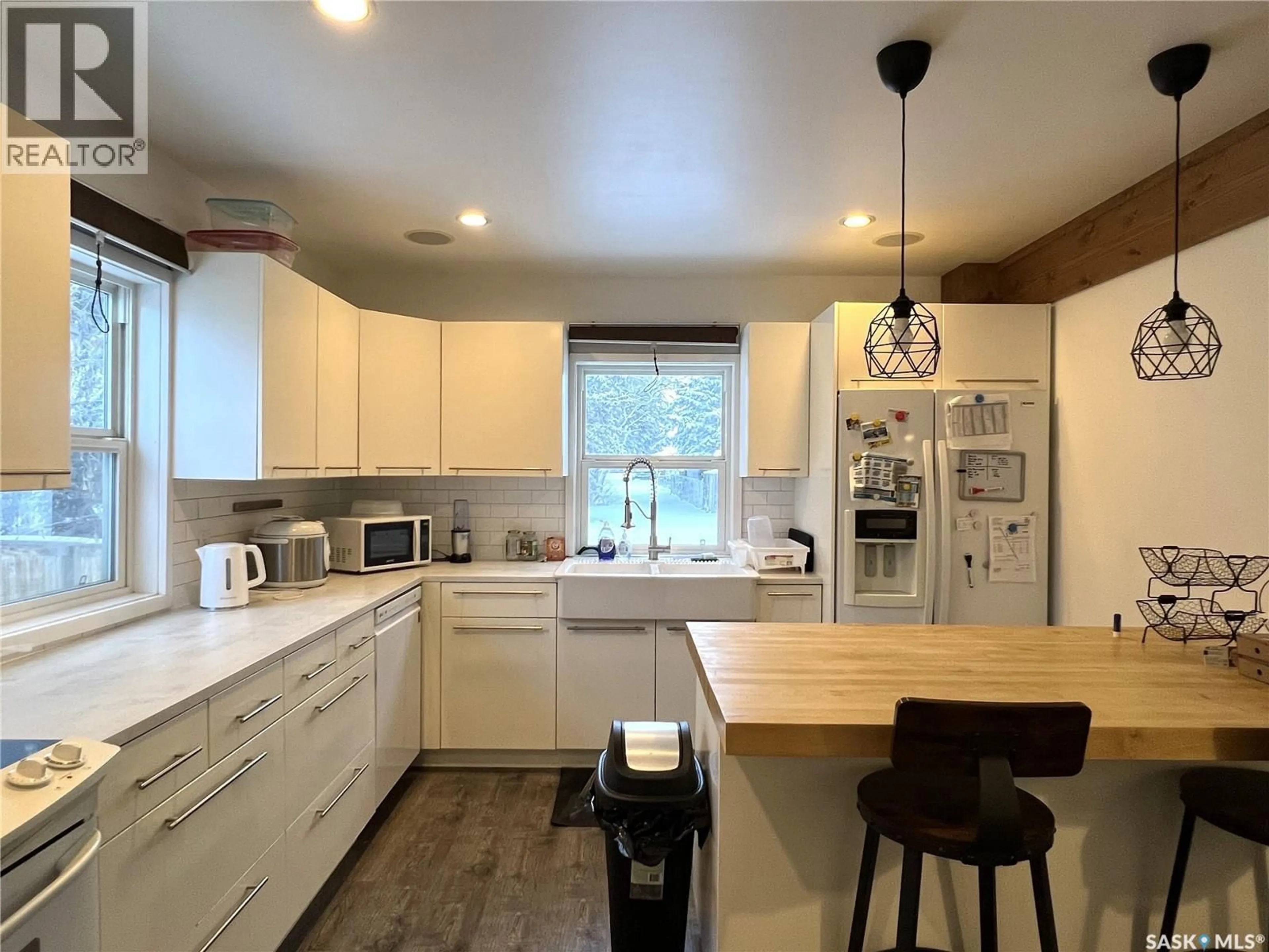 Open concept kitchen, wood/laminate floor for 415 3RD STREET, Meadow Lake Saskatchewan S9X1C8