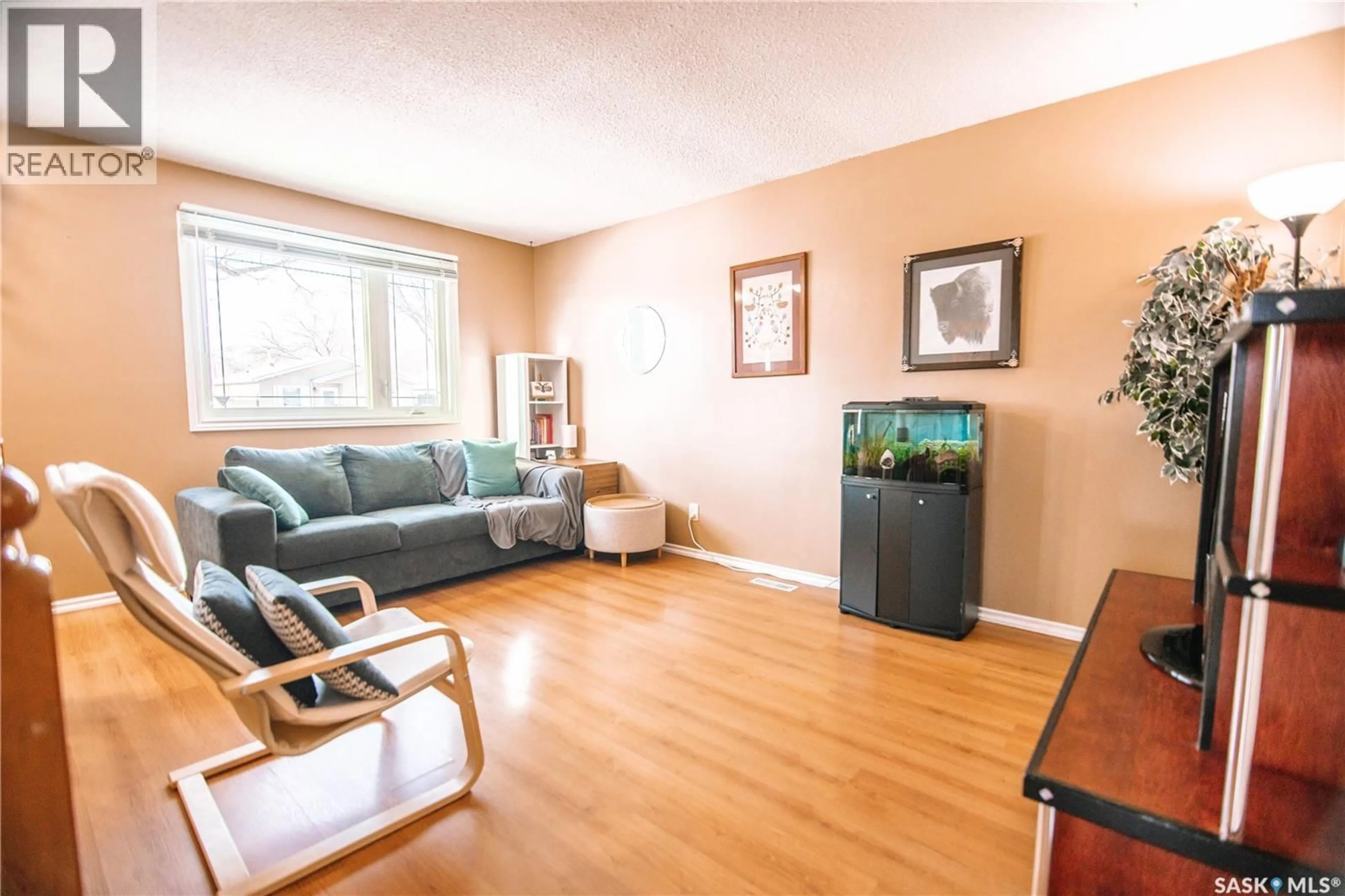 Living room with furniture, wood/laminate floor for 29 NATHAN STREET, Regina Saskatchewan S4R4Z3