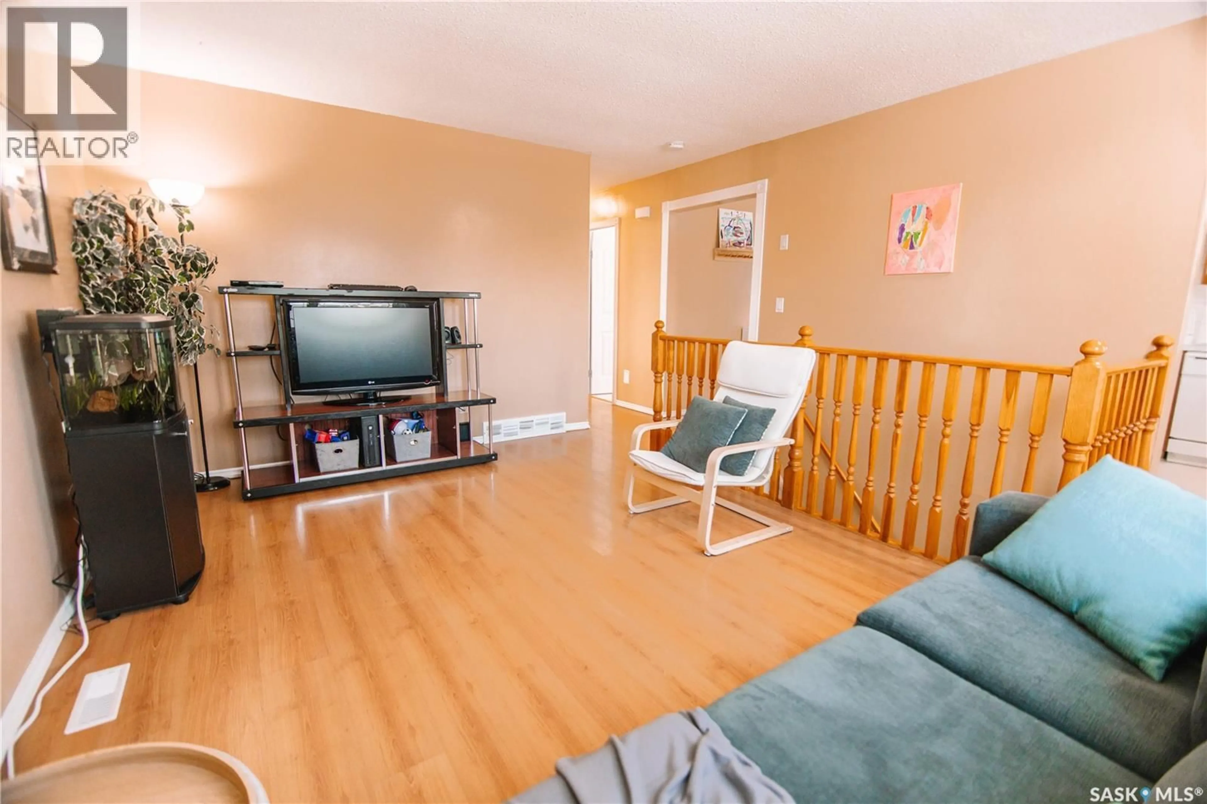 Living room with furniture, wood/laminate floor for 29 NATHAN STREET, Regina Saskatchewan S4R4Z3